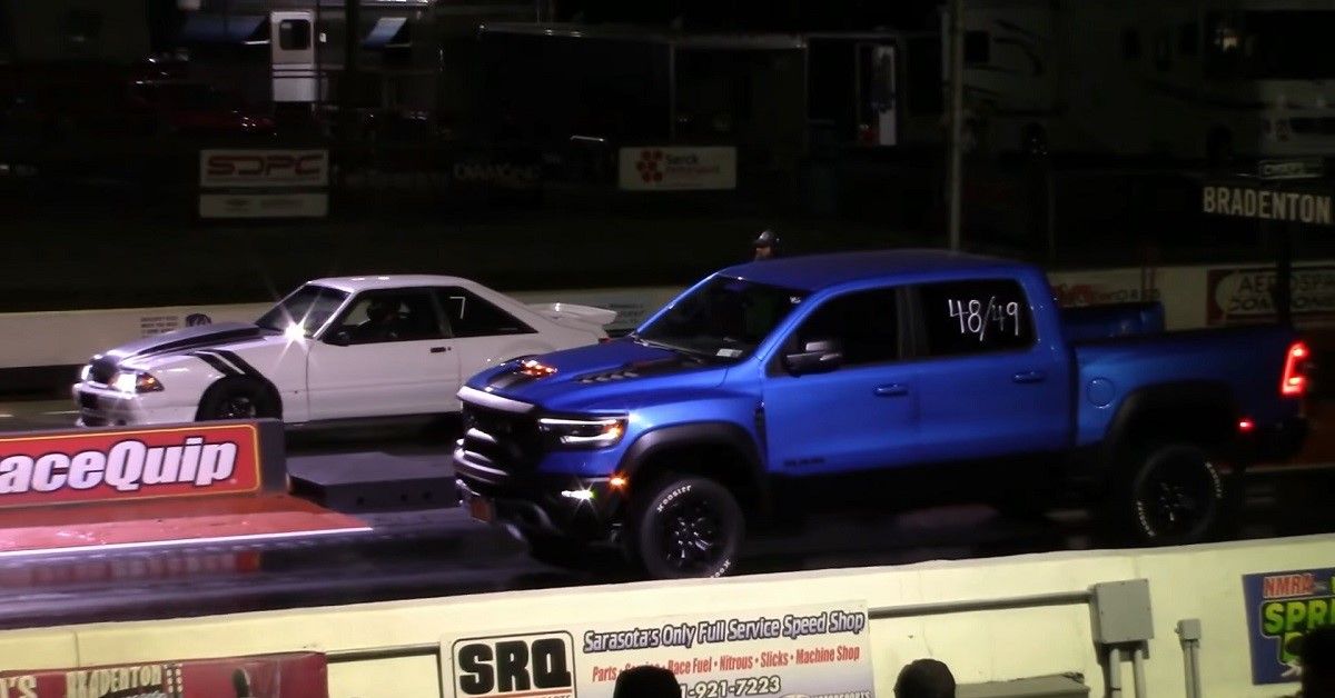 RAM TRX vs Ford Mustang Drag race, night, starting line 