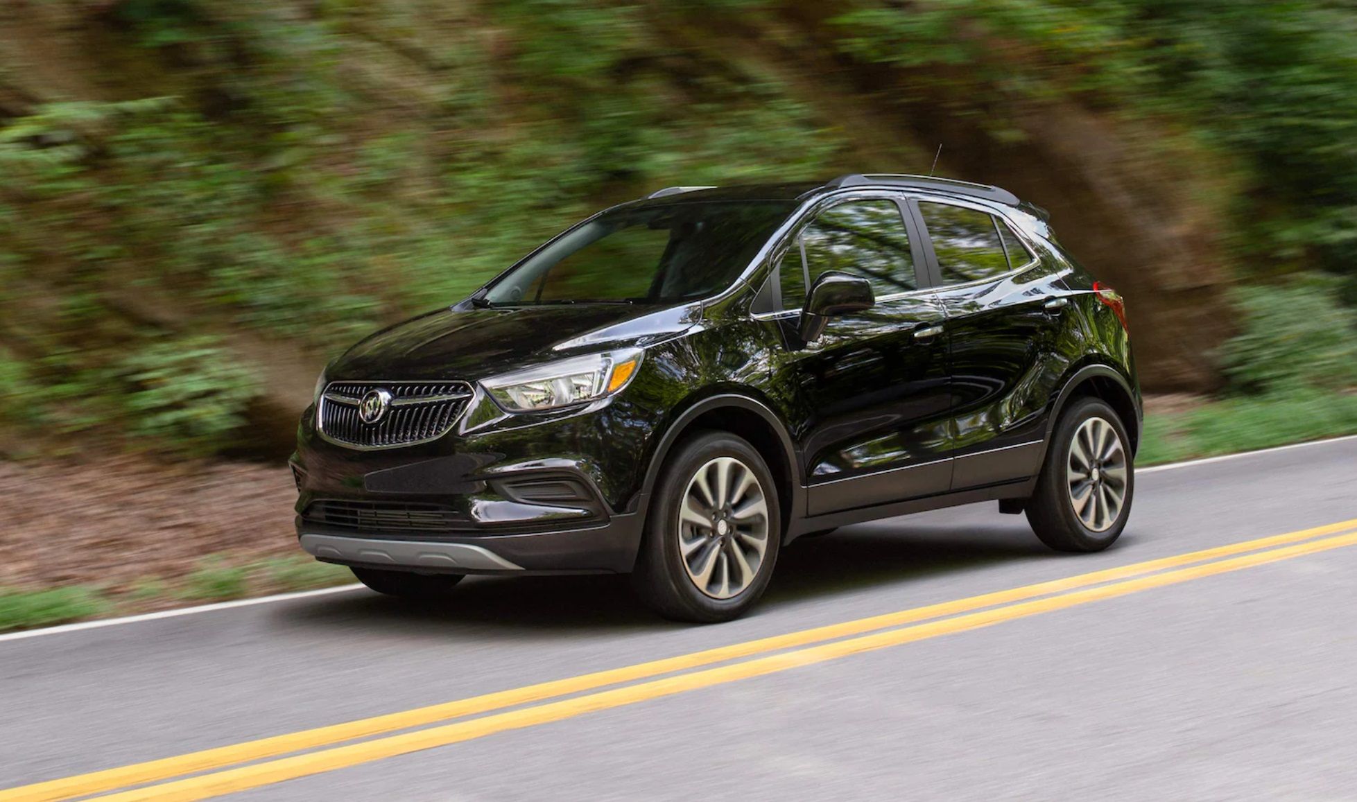 The 2021 Buick Encore speeding up on the road.