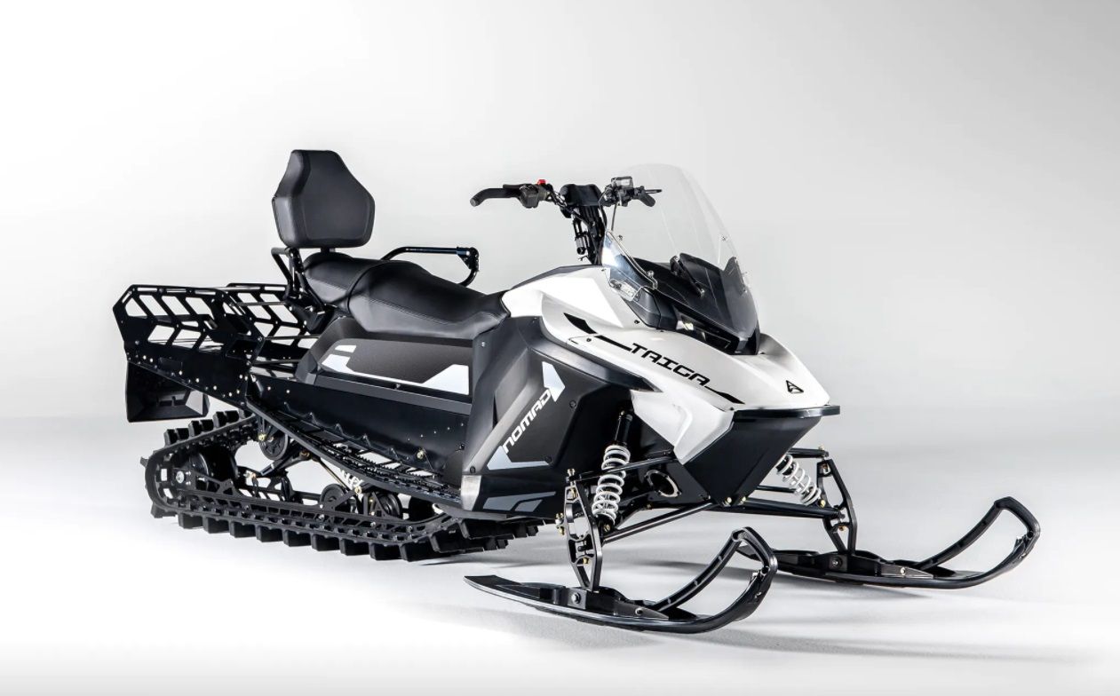 The 2022 Taiga Nomad Electric Snowmobile in a showroom.
