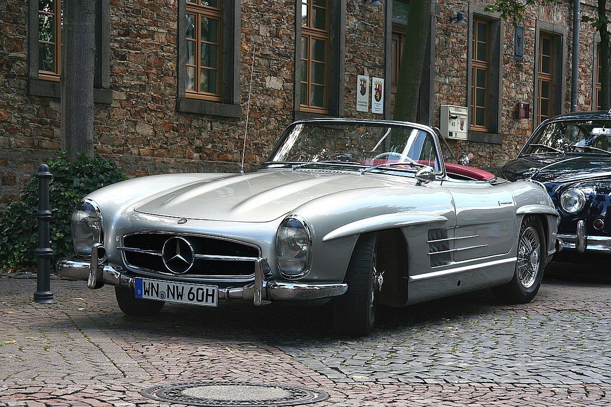 The 1960 Mercedes-Benz 300 SL Roadster parked on the street.