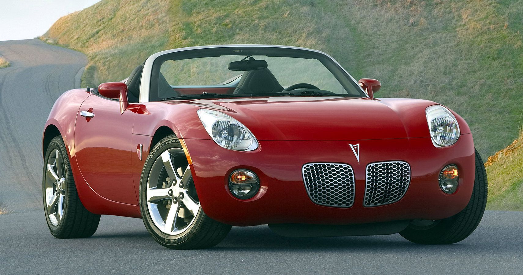 a red 2005 Pontiac Solstice from the front