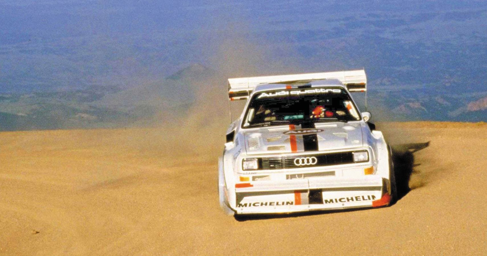Audi Sport Quattro drifting in sand front view