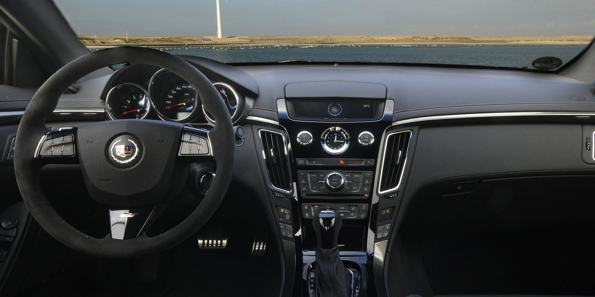 The interior of the CTS-V, manual transmission, infotainment screen down