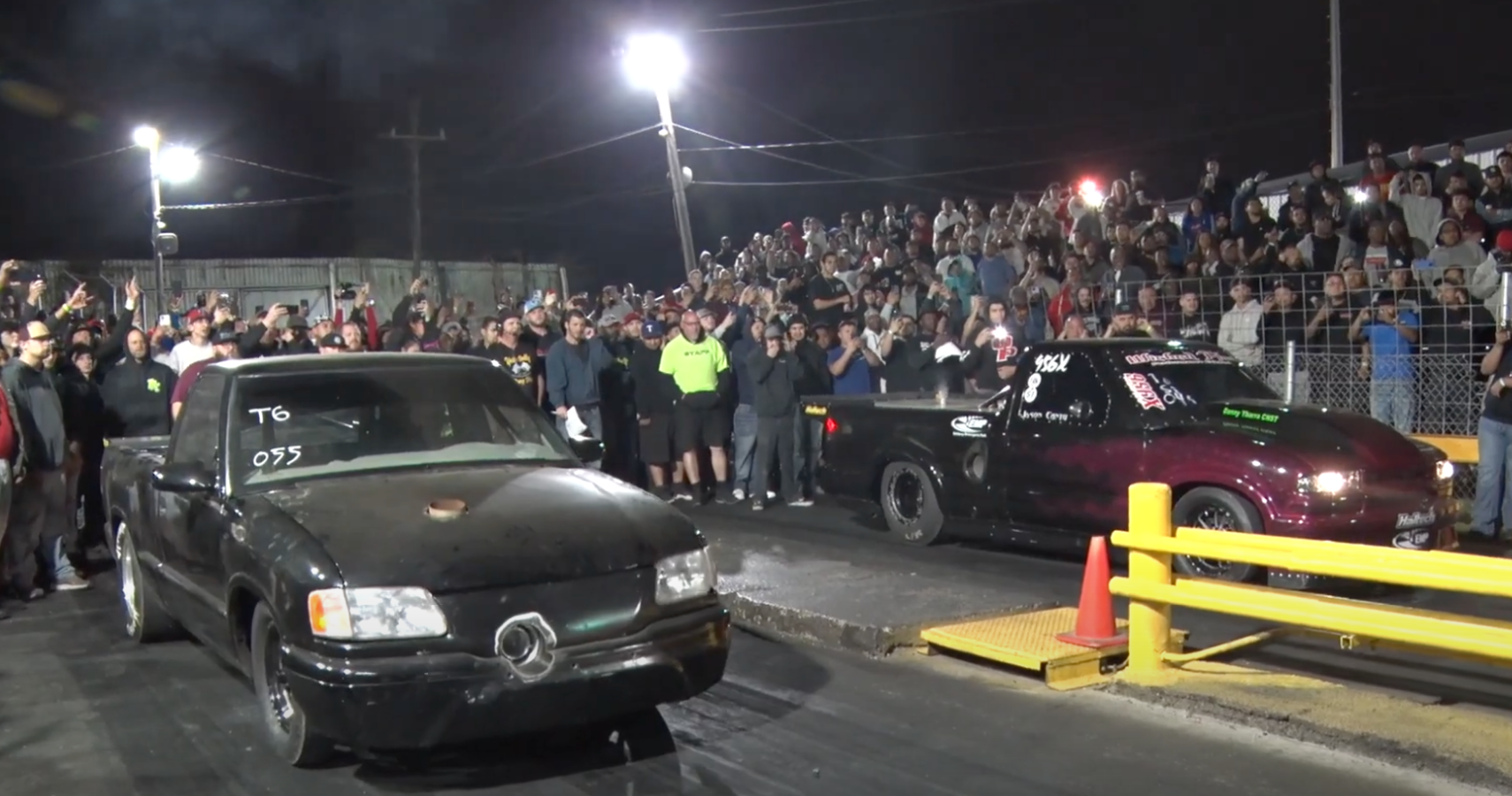 A black Chevrolet S10 lines up to race at the drag strip