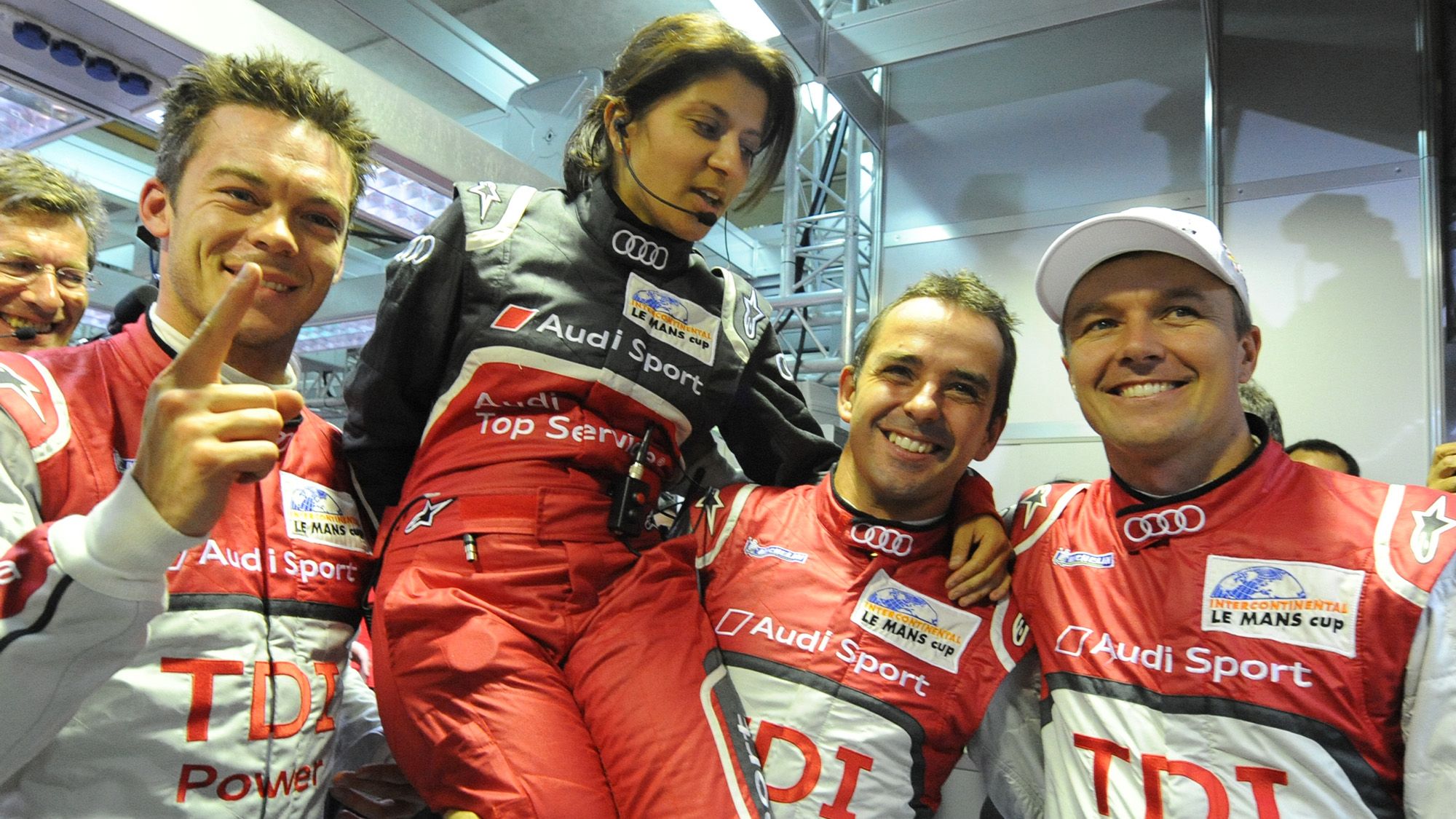 Leena-Gade-is-lifted-up-by-her-Audi-drivers-after-clinching-pole-in-the-2011-Le-Mans-24-Hours