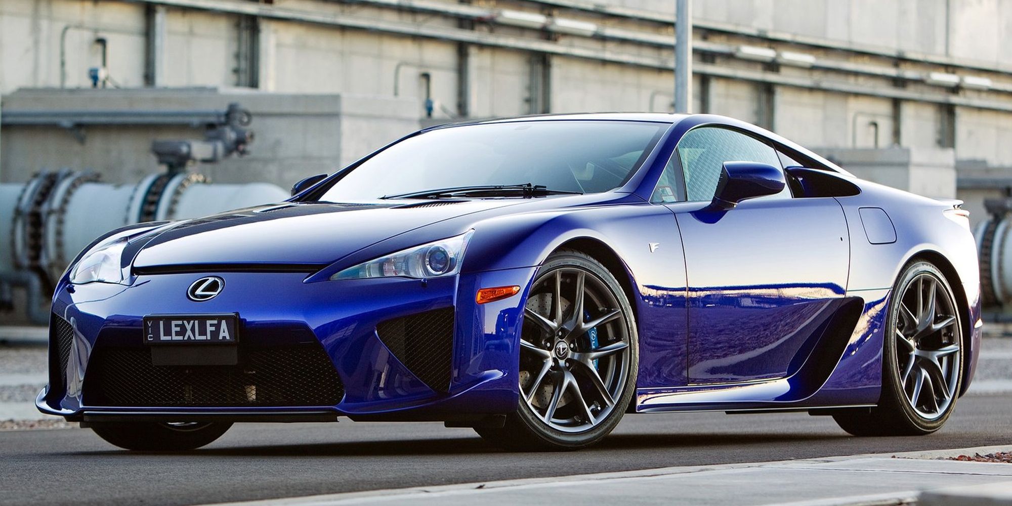 Front 3/4 view of a blue LFA, near an industrial area