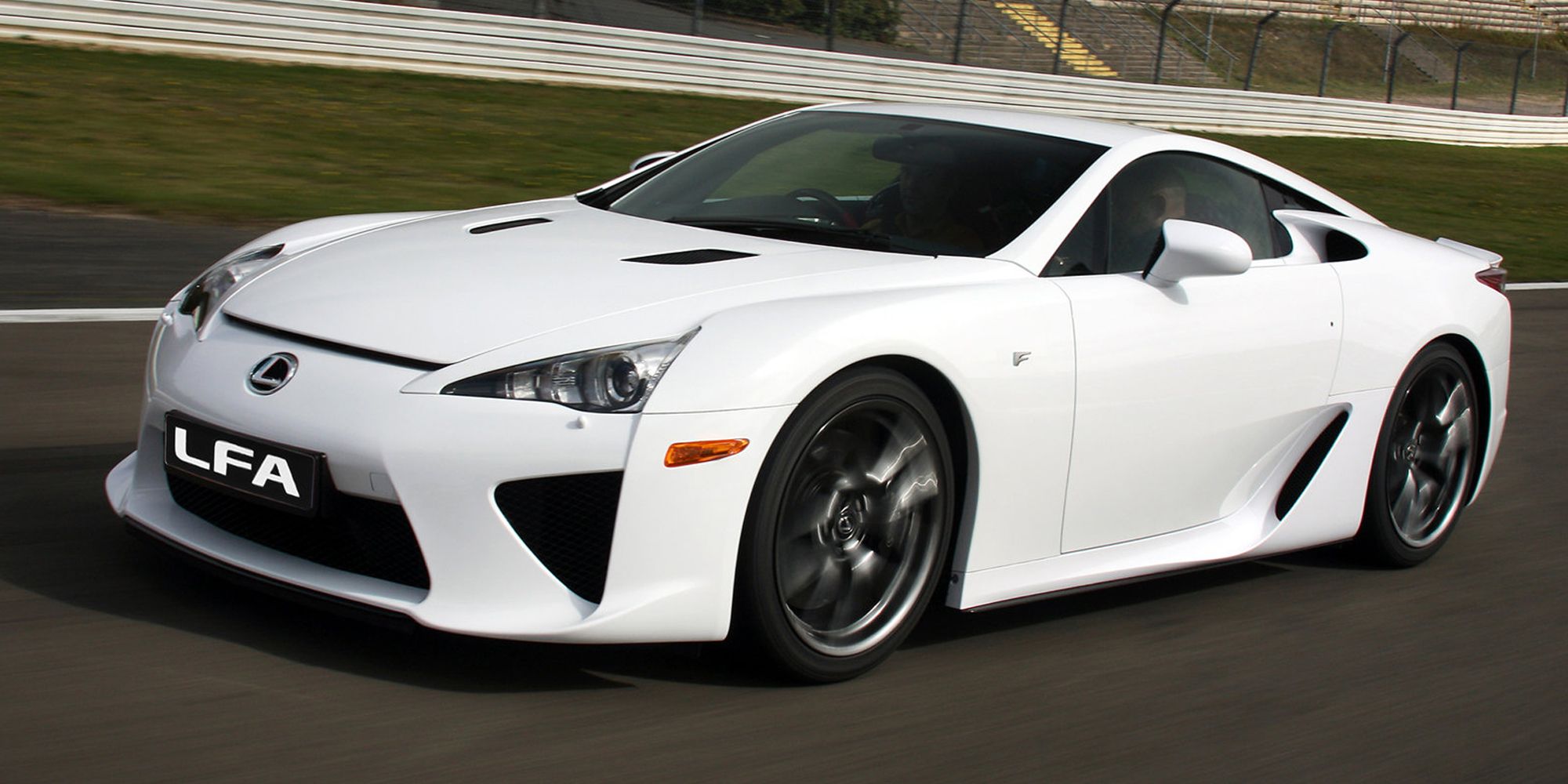 Front 3/4 view of a white LFA on the move on a racetrack