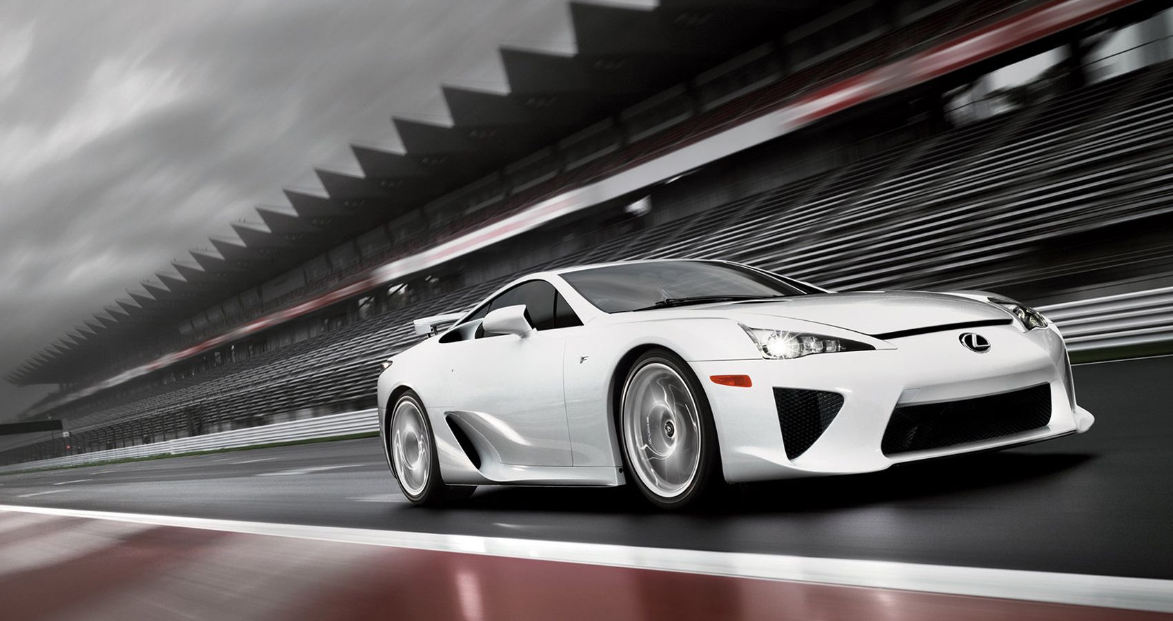 Front 3/4 view of a white LFA on a racetrack