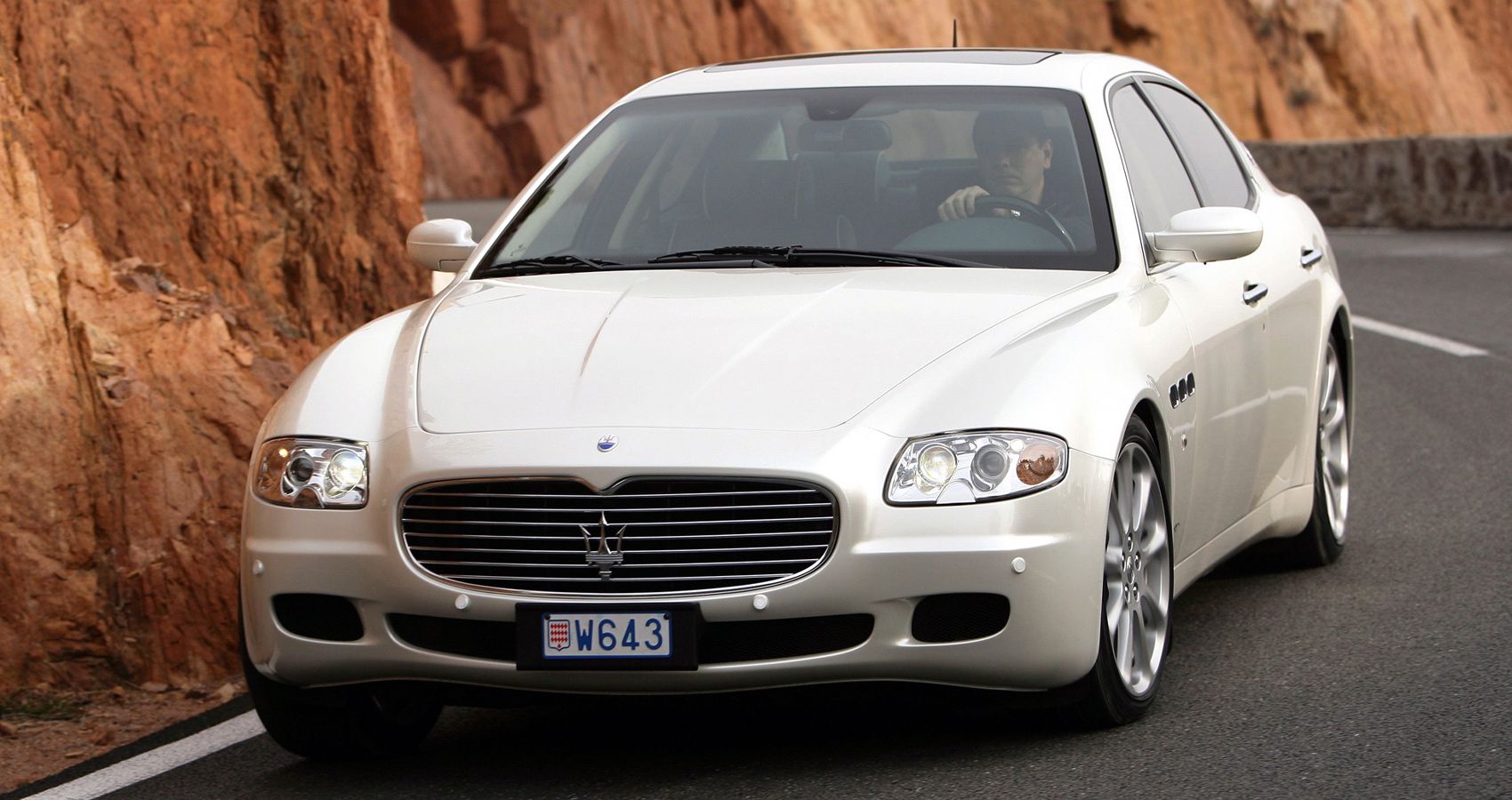 The front of a white Quattroporte on the move