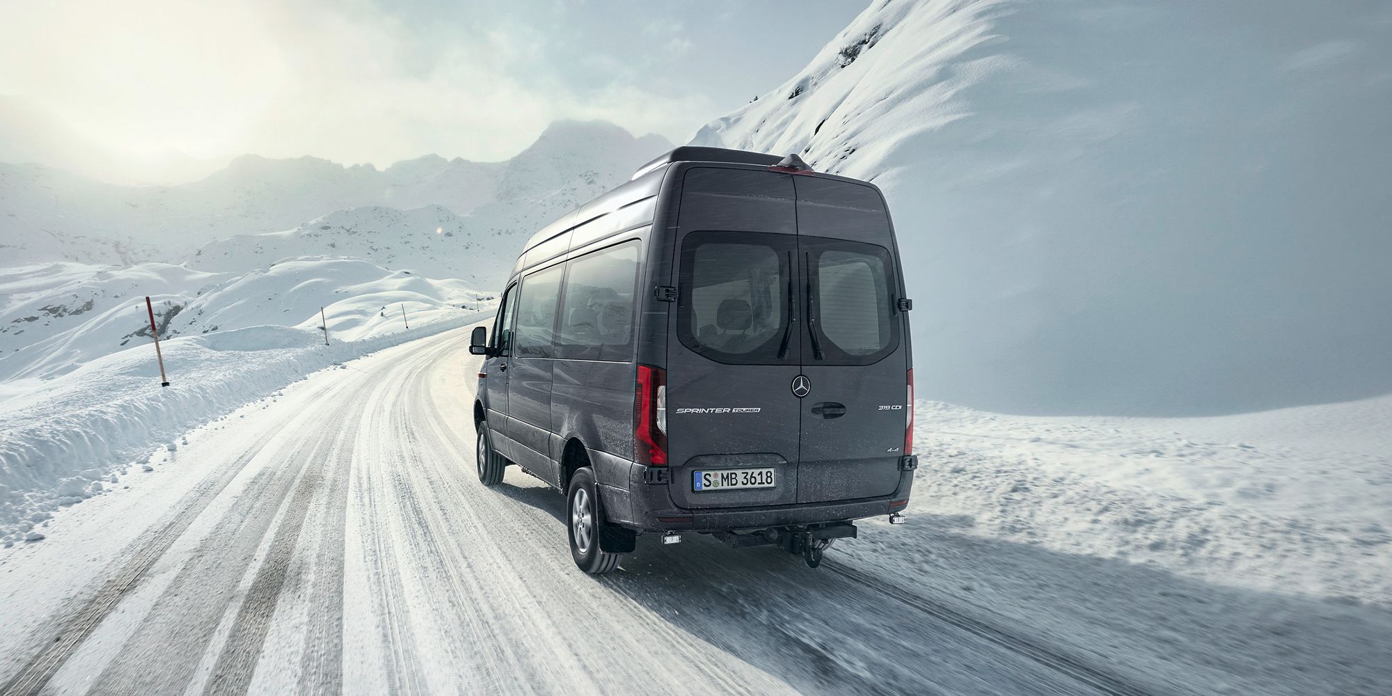 The rear of a Sprinter 4x4 on a snowy road
