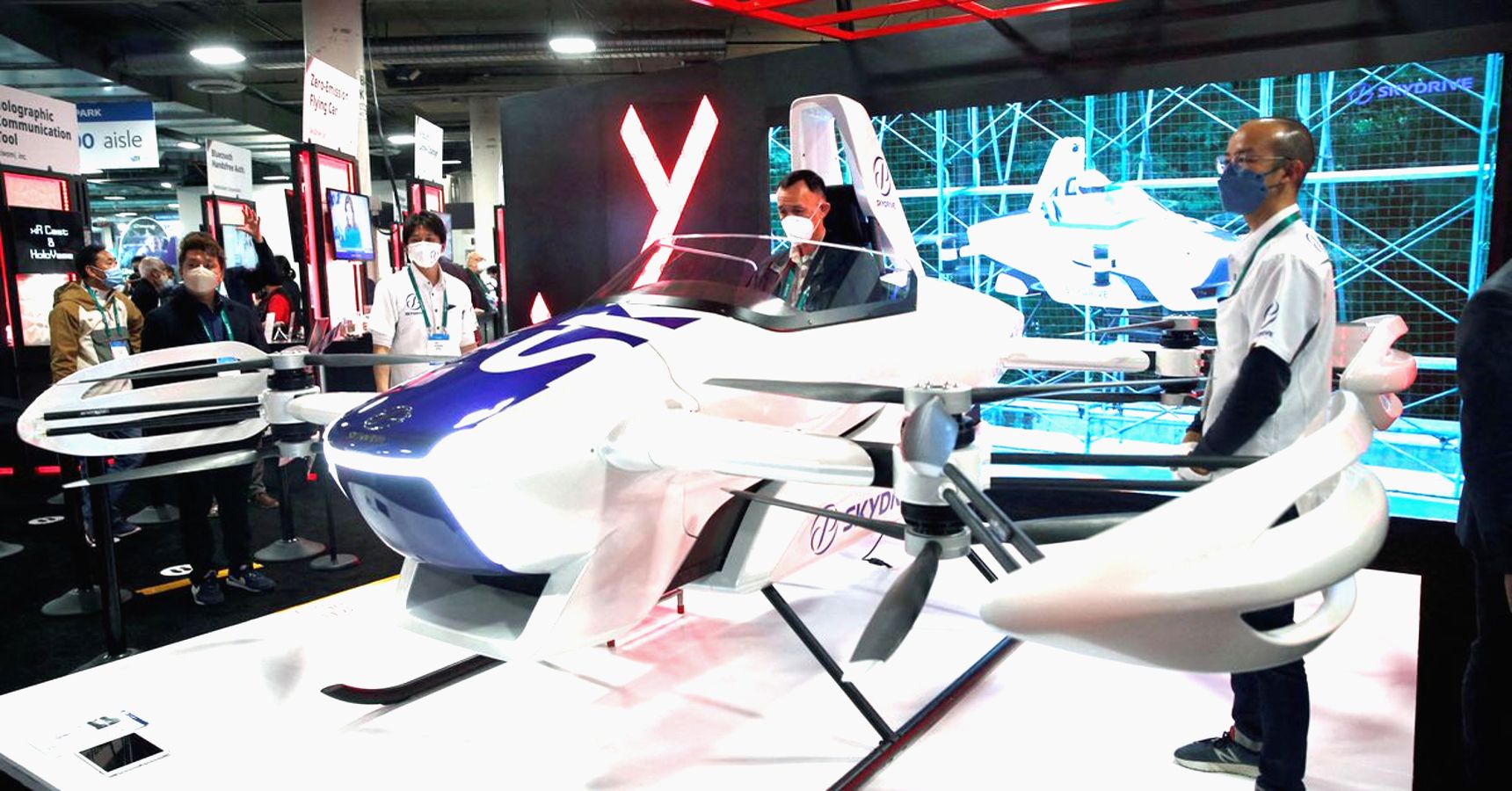 Suzuki and SkyDrive experts testing a demo flying car.