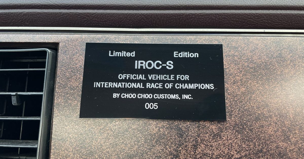 1985 Chevrolet El Camino IROC-S Cho Cho Customs Plaque, black, inside car