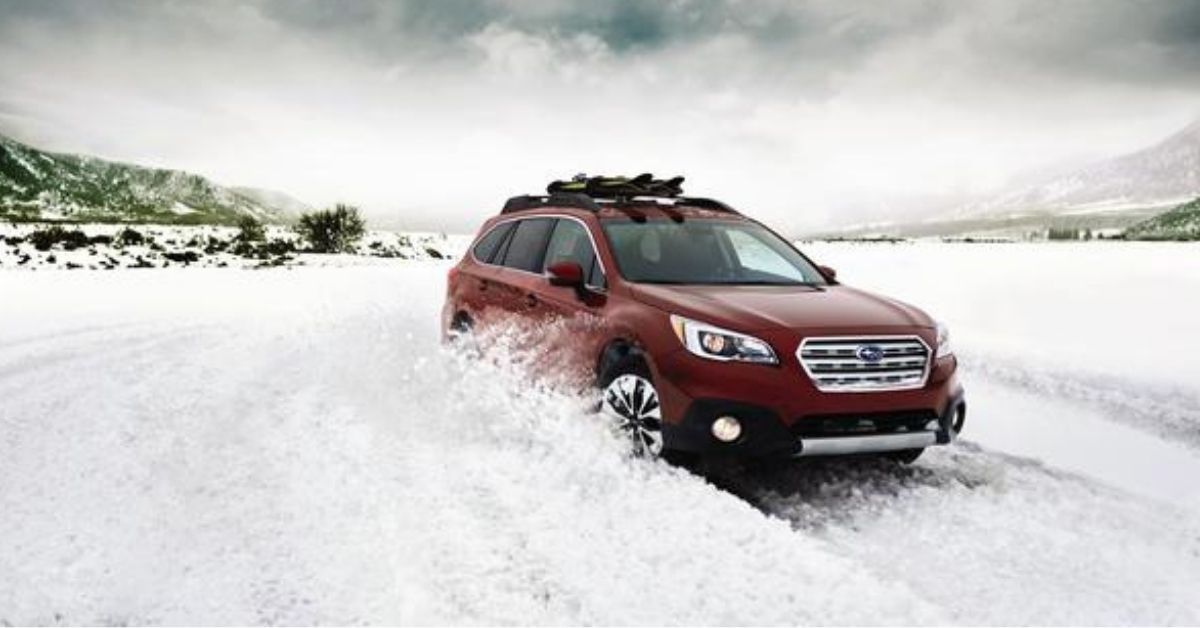 2017 Subaru Outback In Maroon Front View In Snow