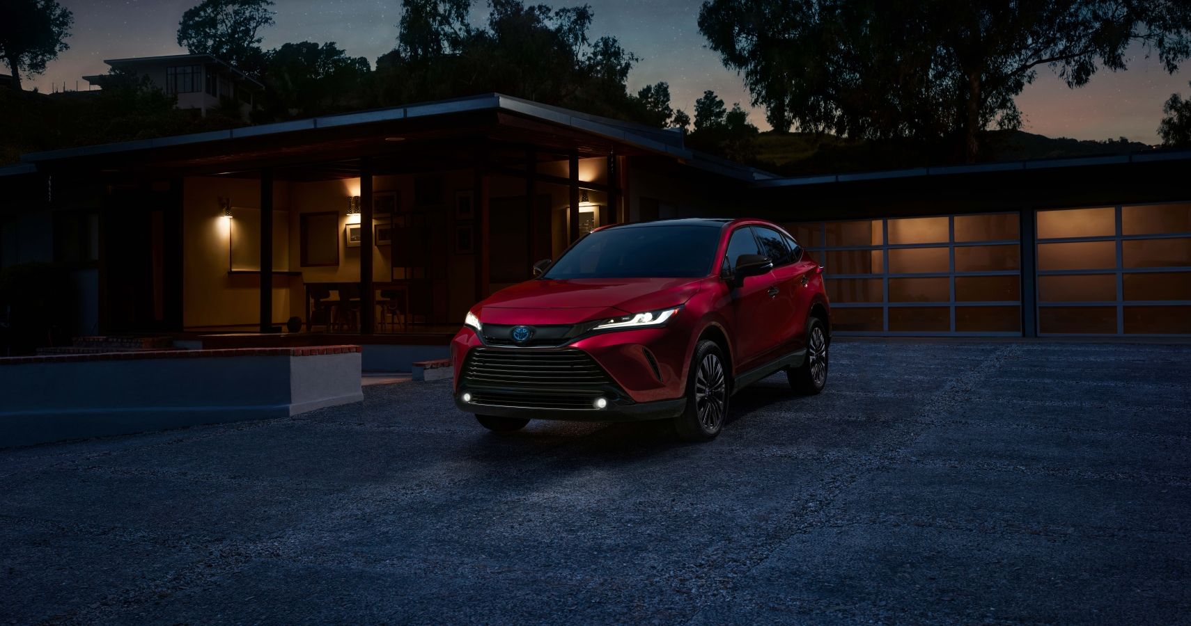 Red 2023 Toyota Venza Nightshade Edition on the driveway
