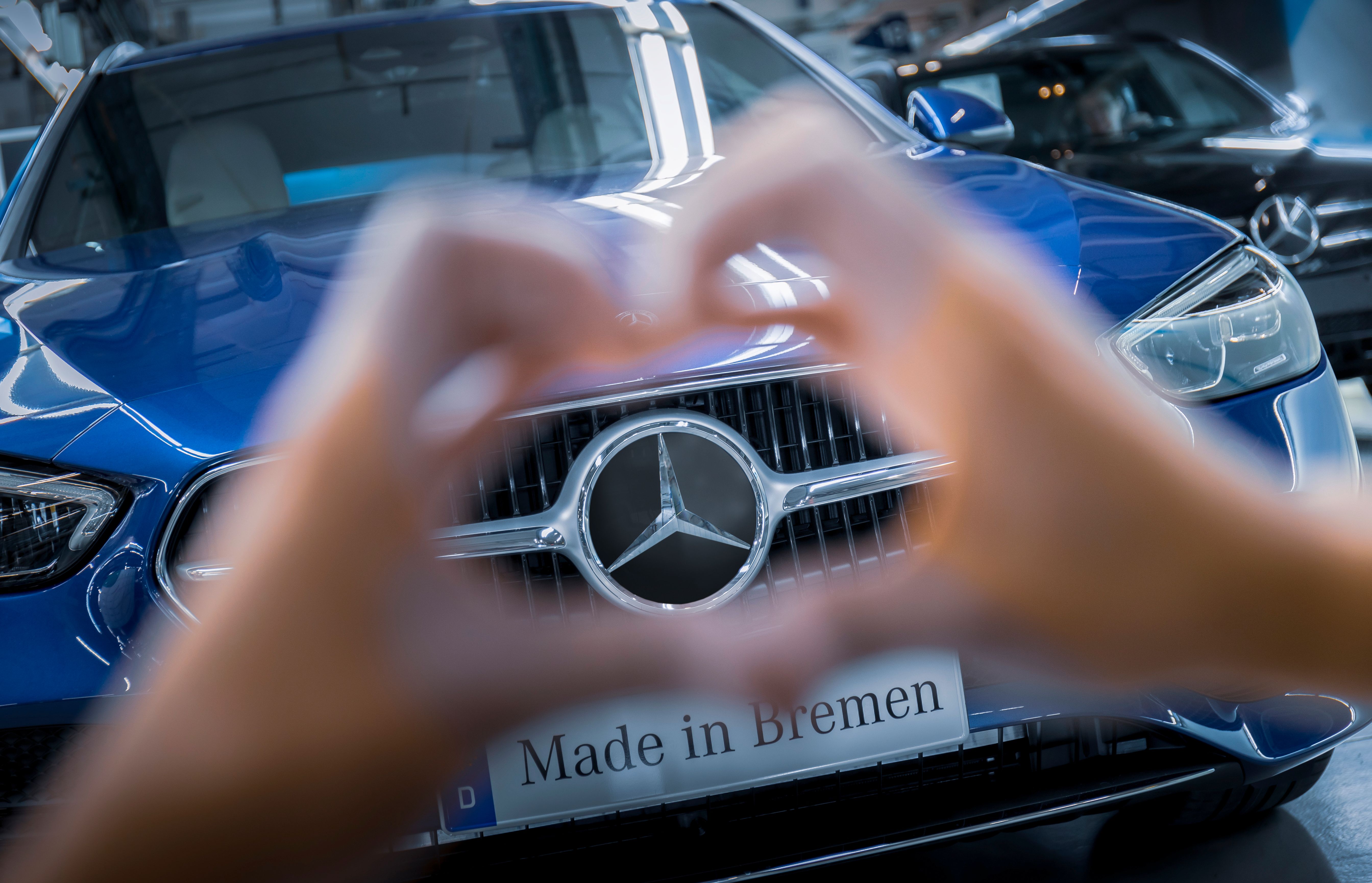 The Mercedes-Benz logo on a car.