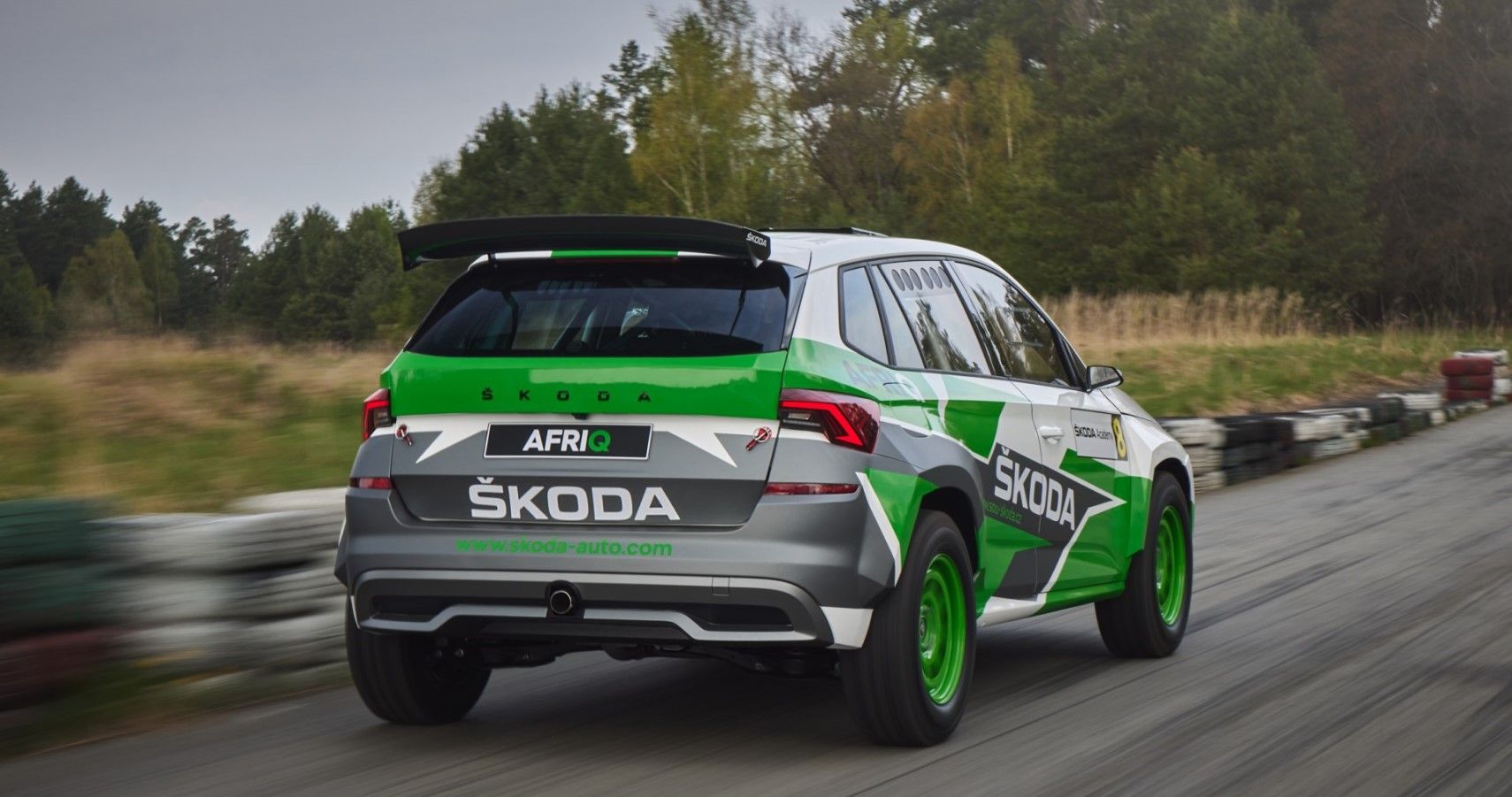 Skoda Afriq accelerates on the track seen from the rear third quarter