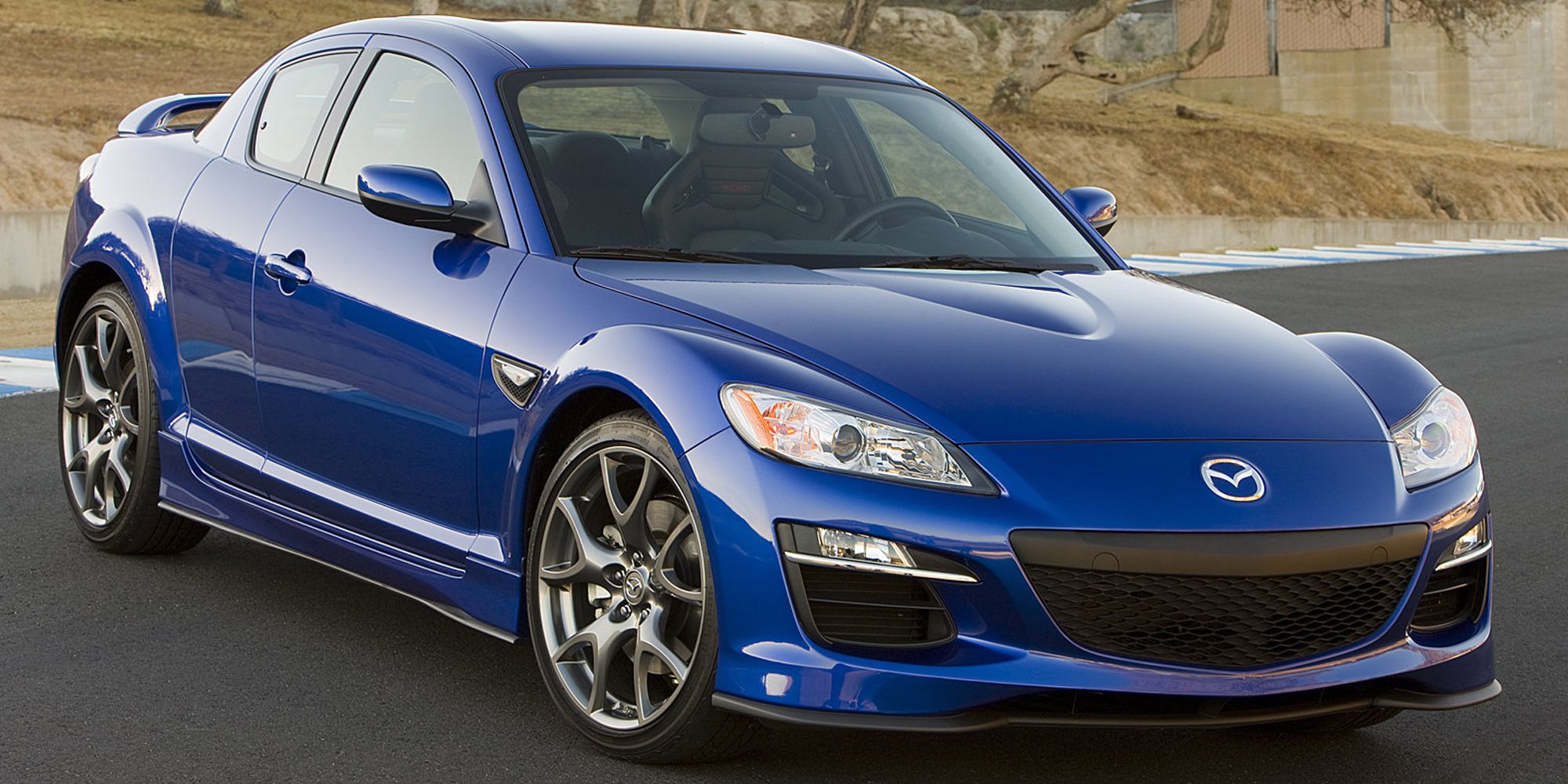Front 3/4 view of a blue RX-8 