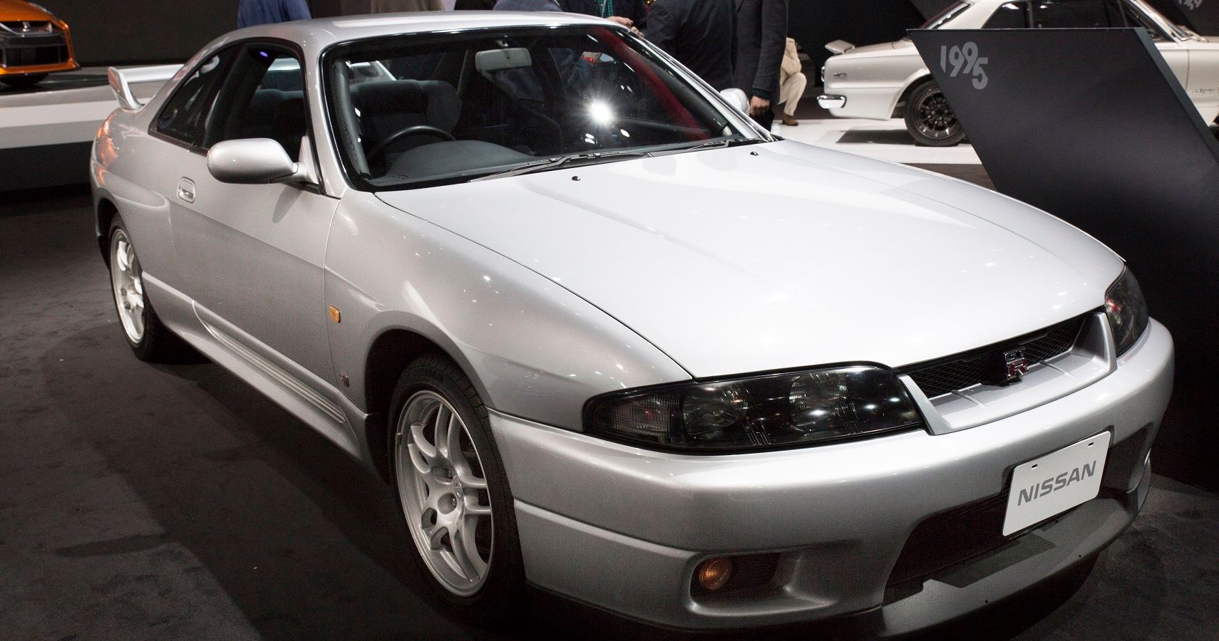 White Nissan Skyline, front and passenger side view
