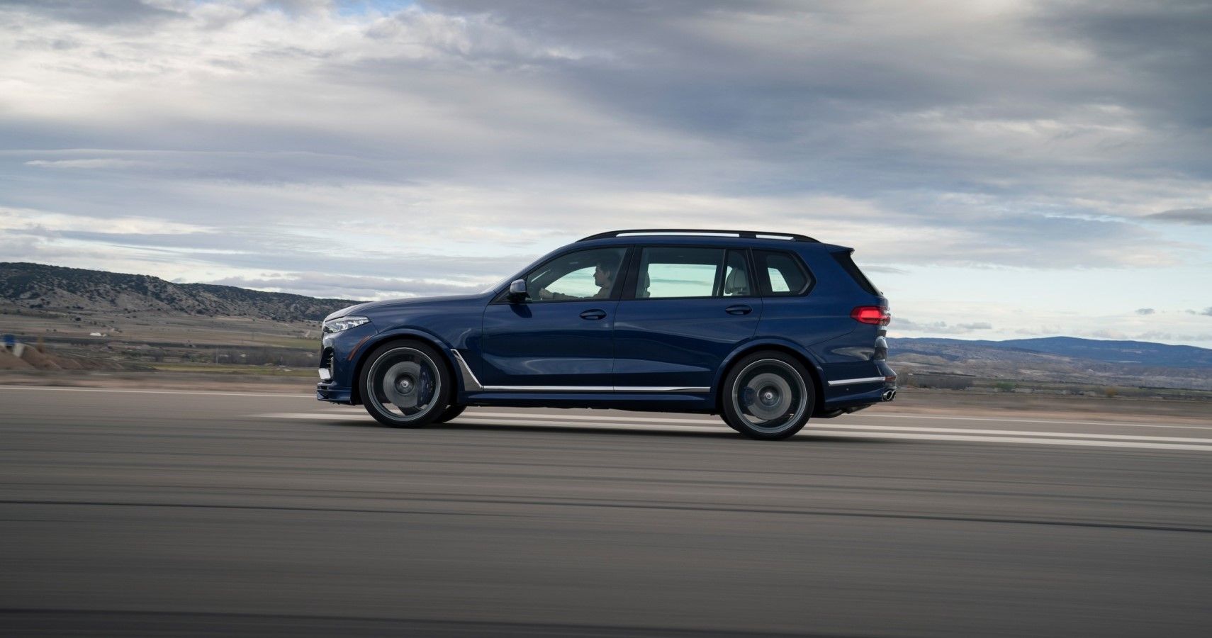 2022 BMW Alpina XB7 accelerating side view