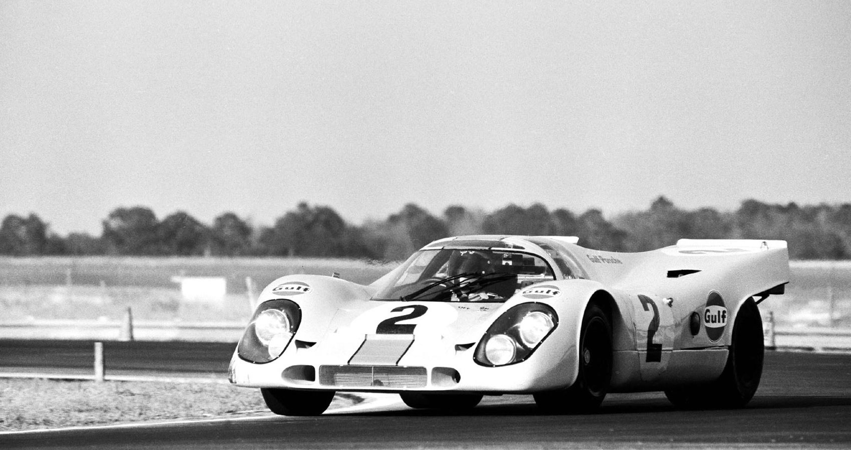 The front of a Gulf-liveried 917 on track, black and white picture