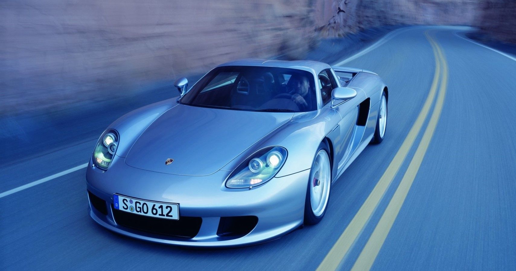 Porsche Carrera GT front third quarter accelerating view