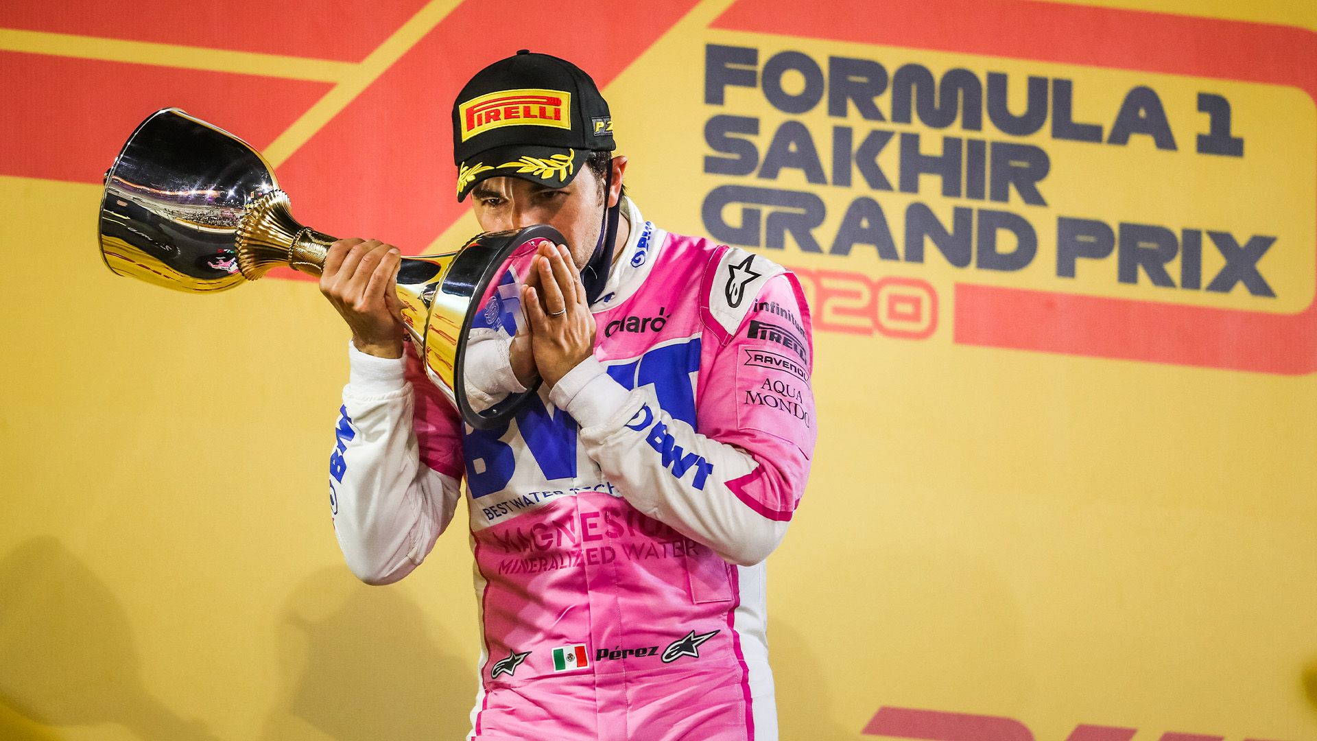 Sergio-Perez-kisses-his-trophy-after-winning-the-2020-Sakhir-Grand-Prix