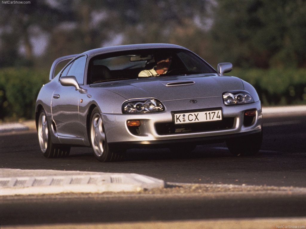 Toyota Supra 1996, silver, front quarter view on track