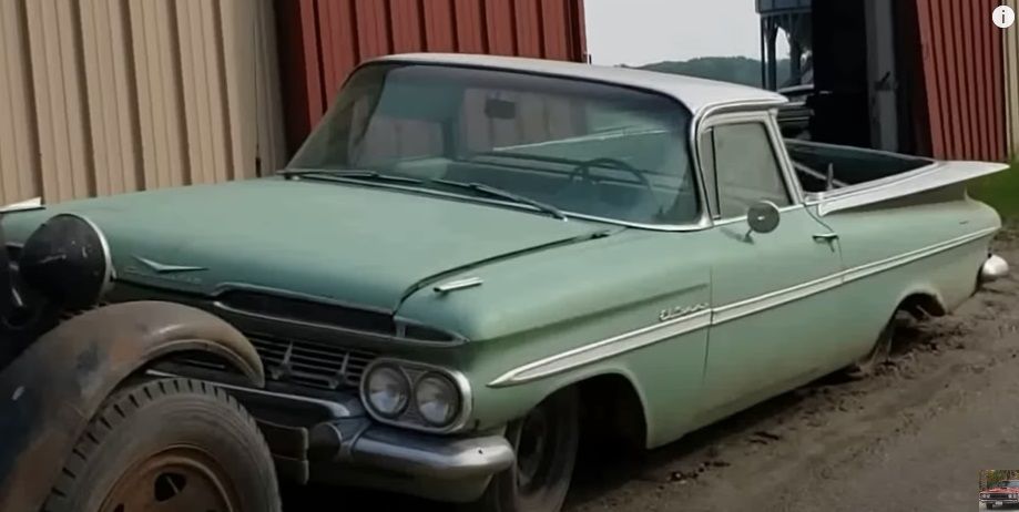 A green and white 1959 Chevrolet El Camino, front quarter view