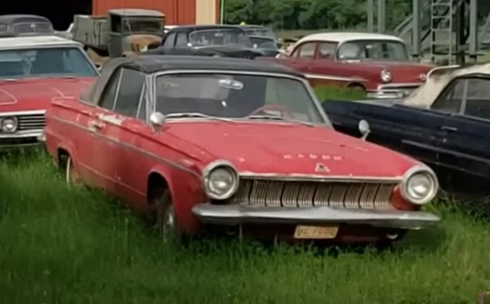 A red 1963 Dodge Dart convertible, front quarter view
