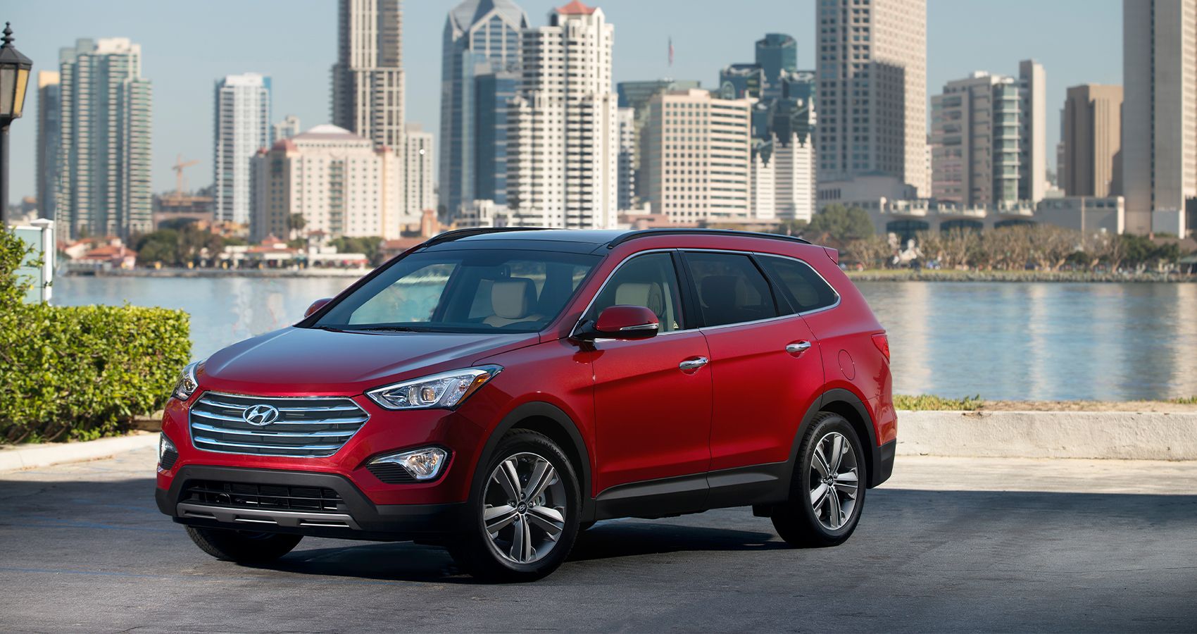 Red 2014 Hyundai Santa Fe on the road