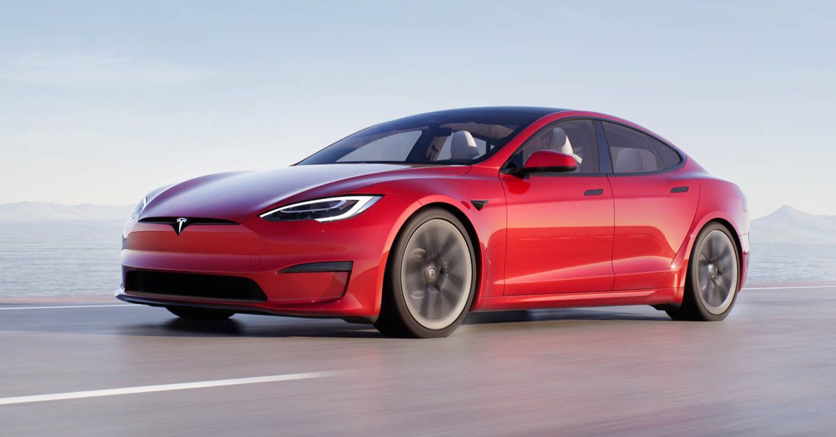 Red 2022 Tesla Model S Cruising On The Road