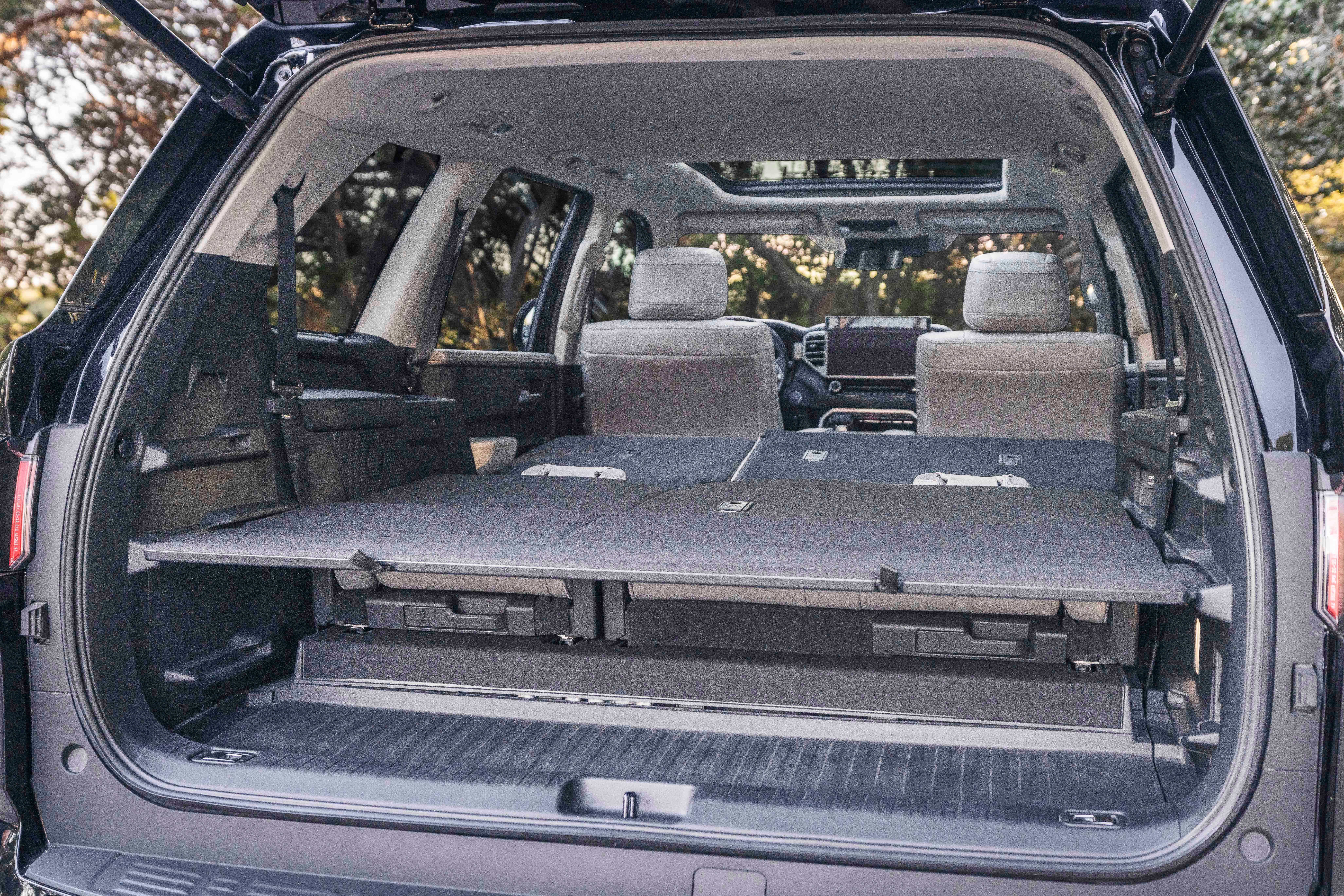 2023_Toyota_Sequoia rear hatch open seats down press photo