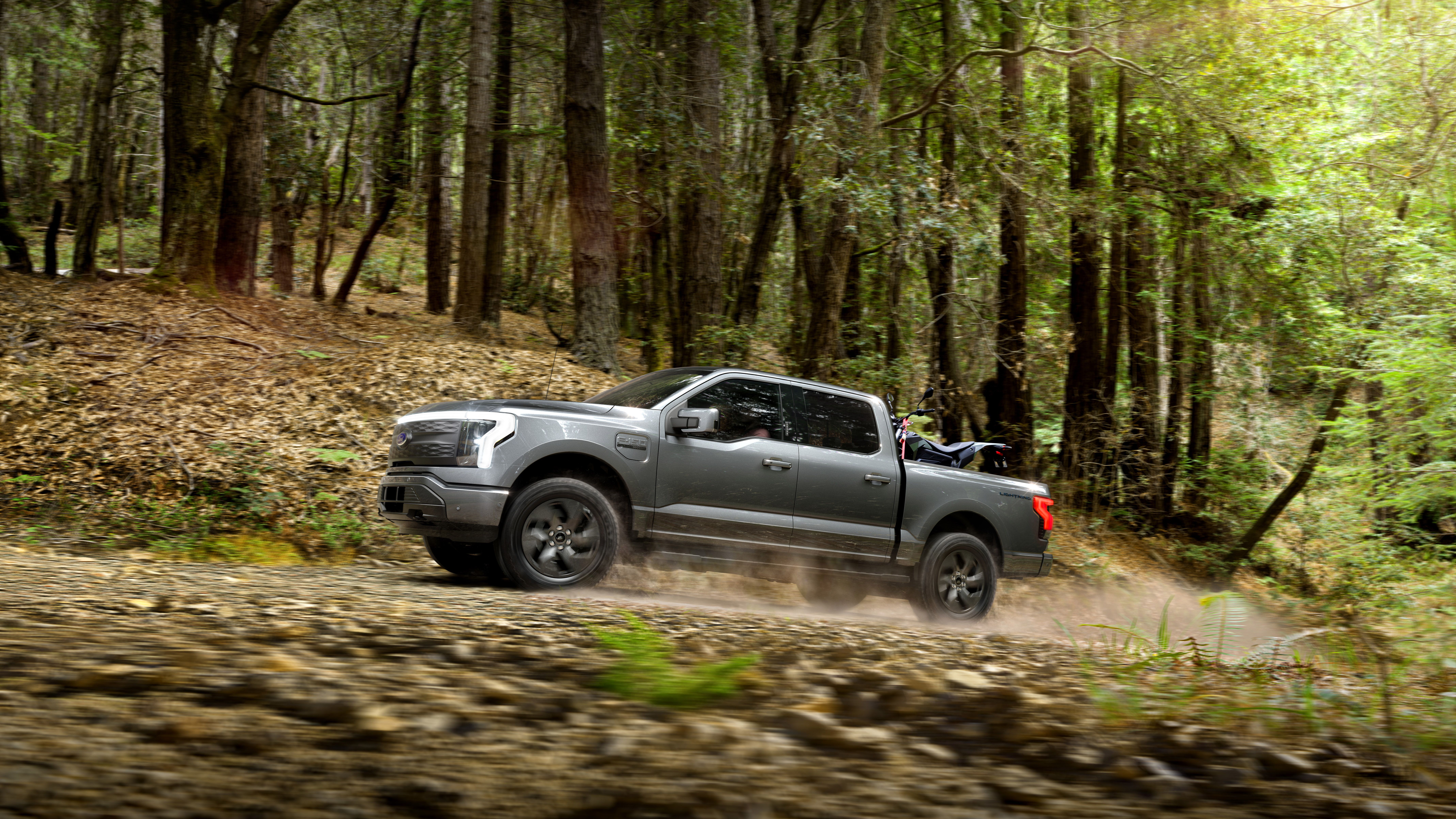 The 2022 Ford F-150 off-road, side profile view from distance