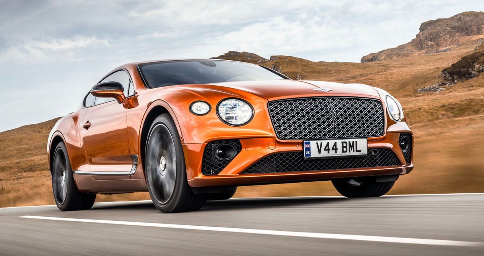 Orange Bentley Continental GT Mulliner Being Driven