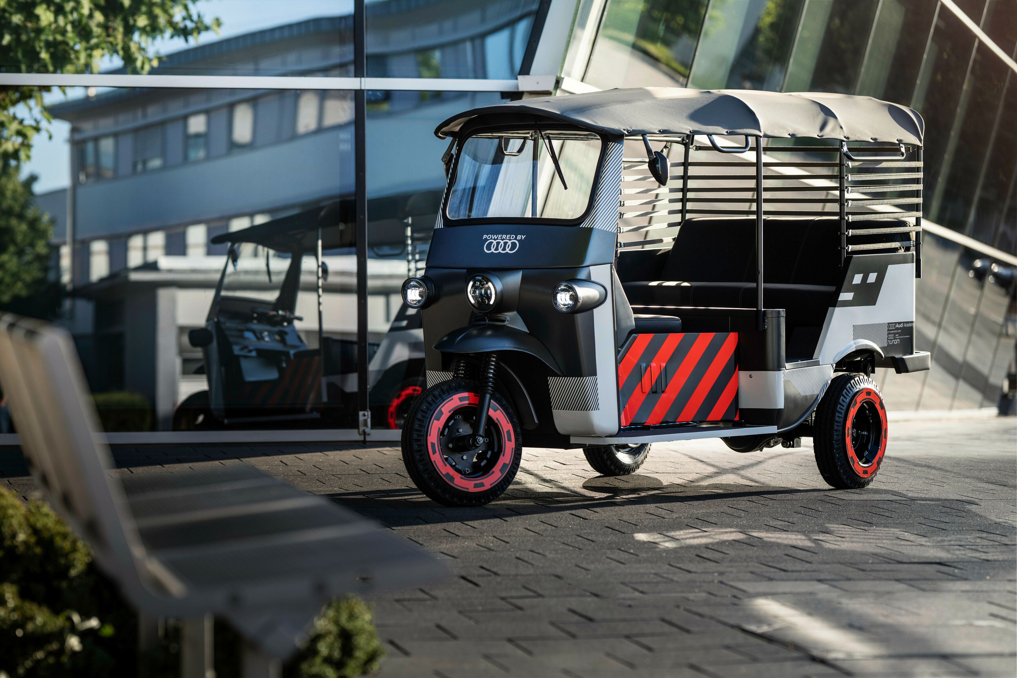 A closer look at the Audi and Nunam E-Rickshaw.