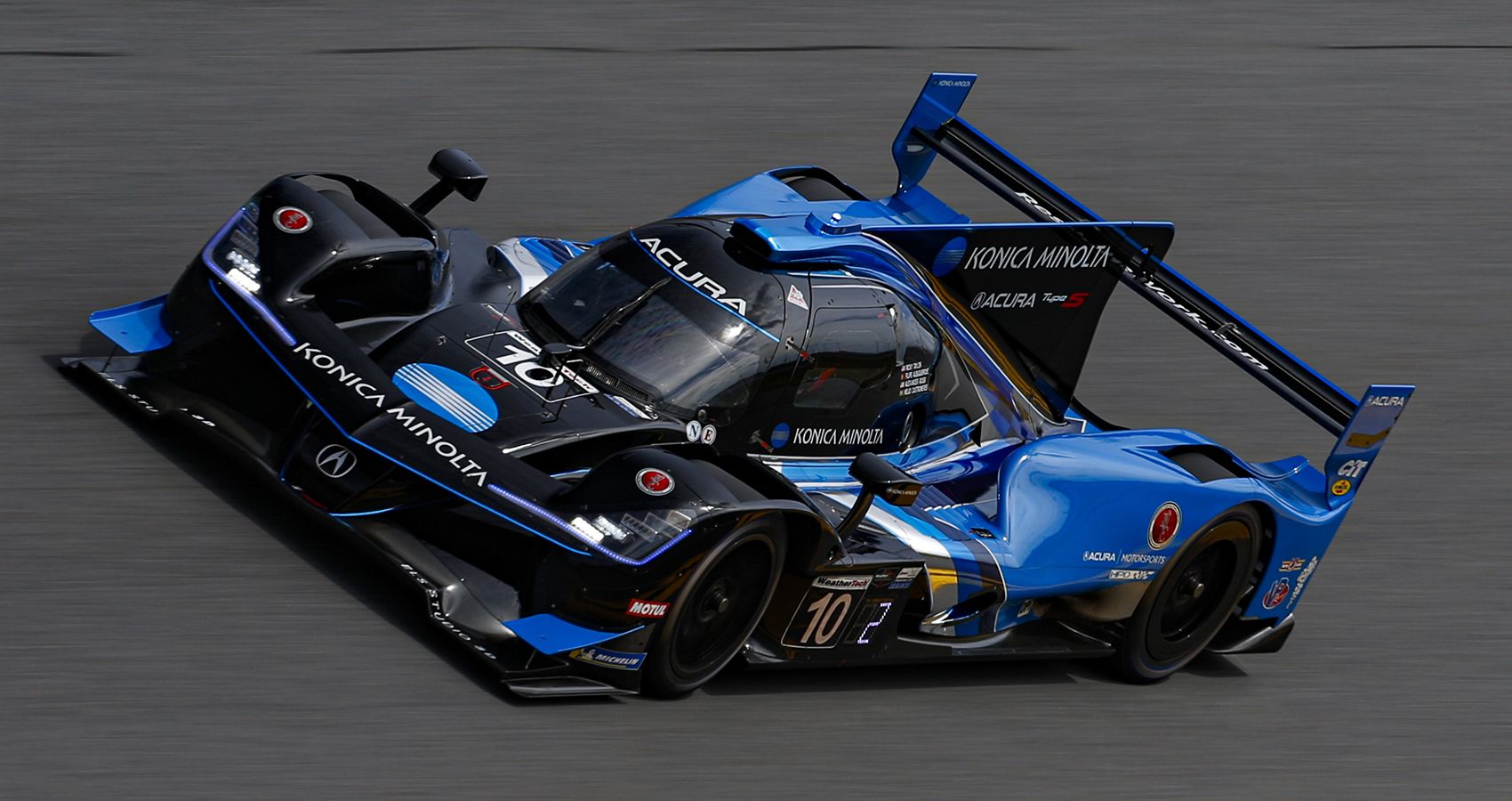 Acura ARX-05 blue, on track, front quarter view