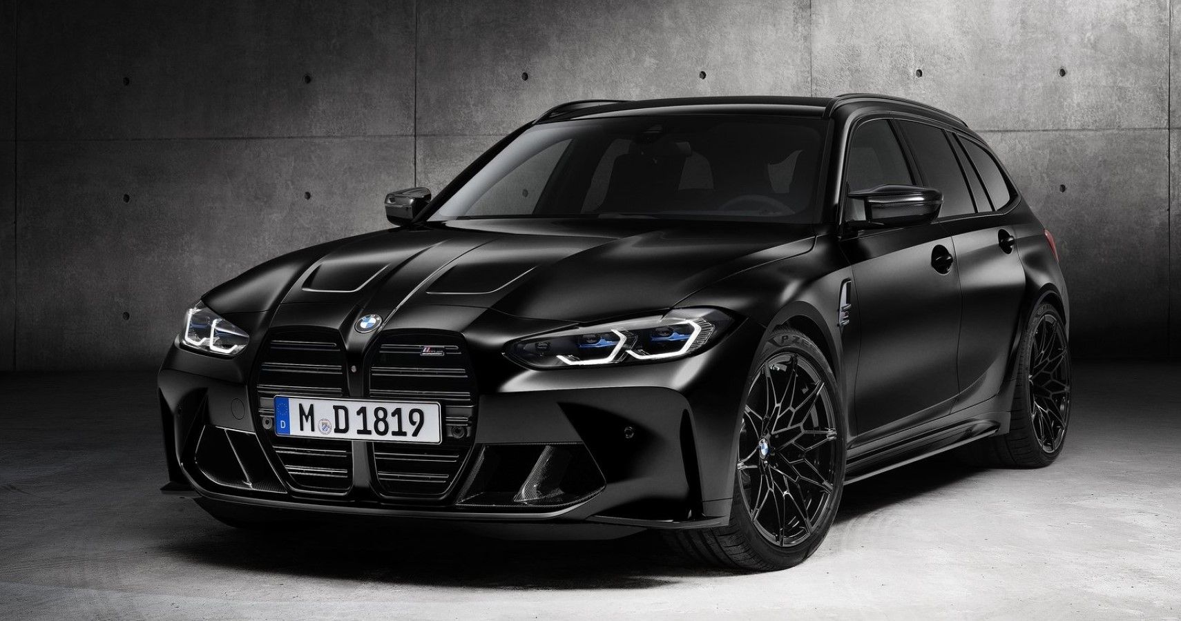 2023 BMW M3 Touring in all-black front third quarter view