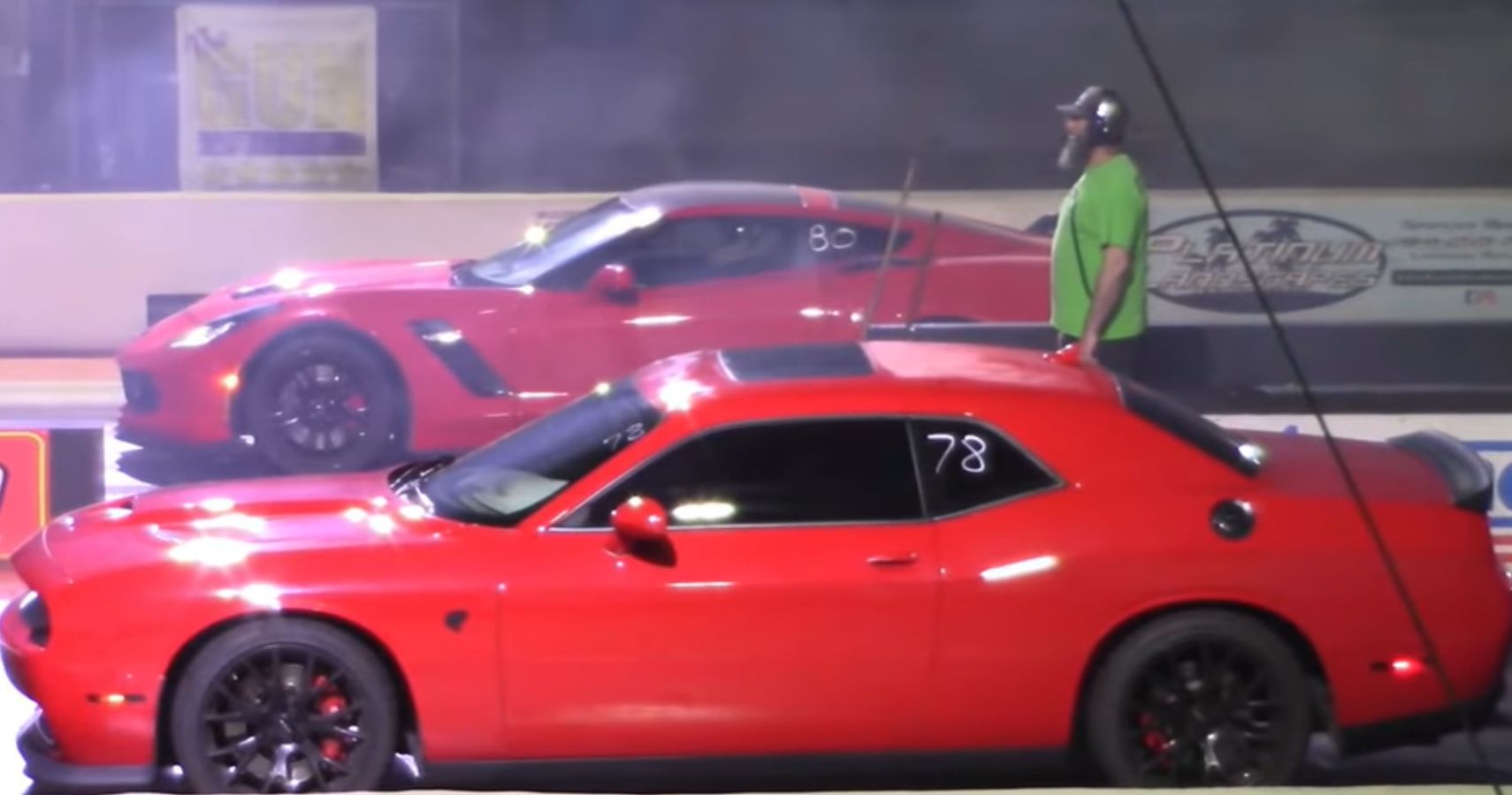 Red C7 Chevrolet Corvette Against A Red Dodge Challenger Hellcat