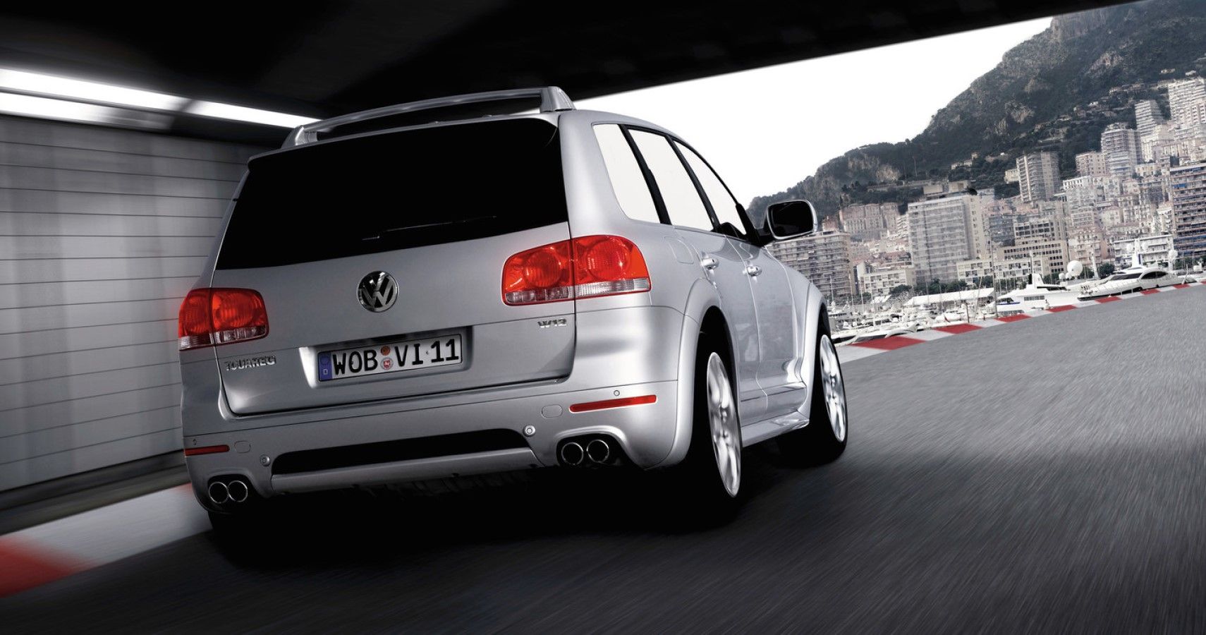 Volkswagen Touareg W12 accelerating rear third quarter view