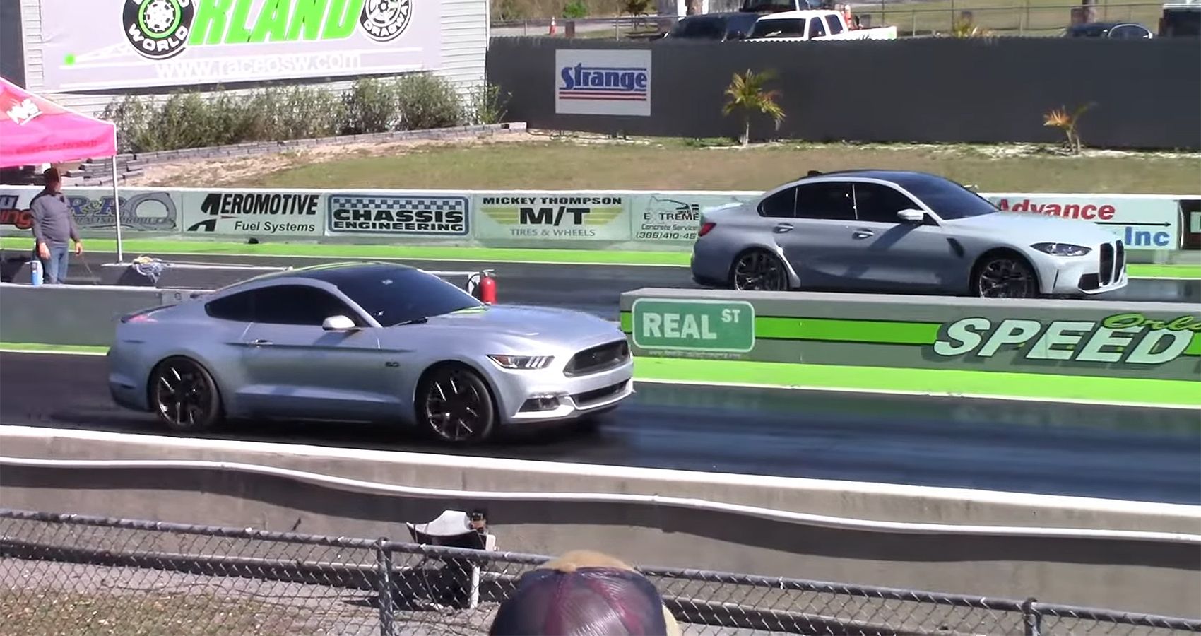 Ford Mustang GT vs BMW M3 Drag Race, front quarter view from afar