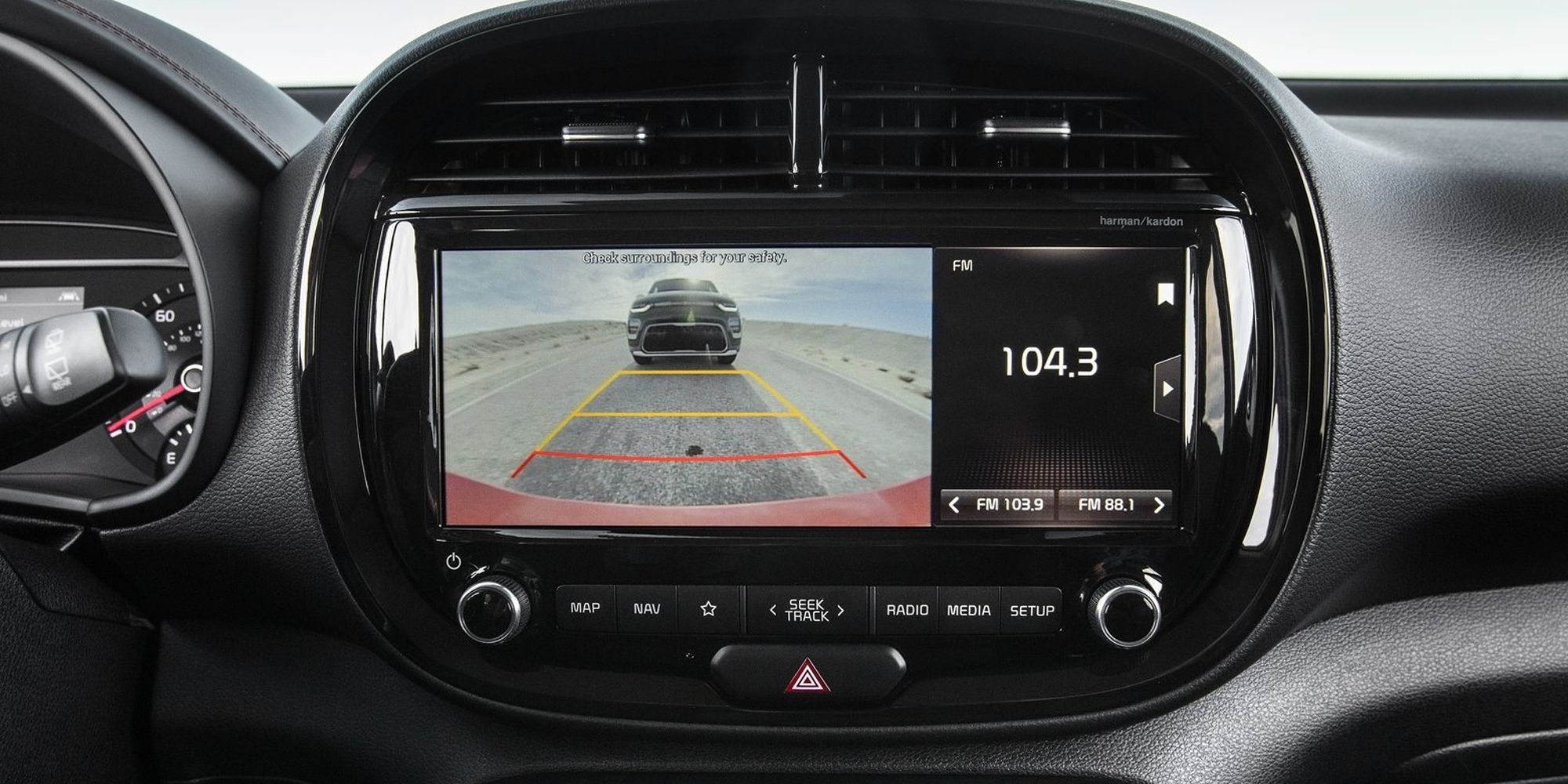 The infotainment system in the Kia Soul, showing the backup camera and radio frequency