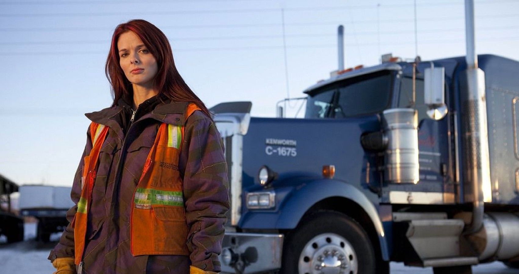 Lisa Kelly posing with a truck