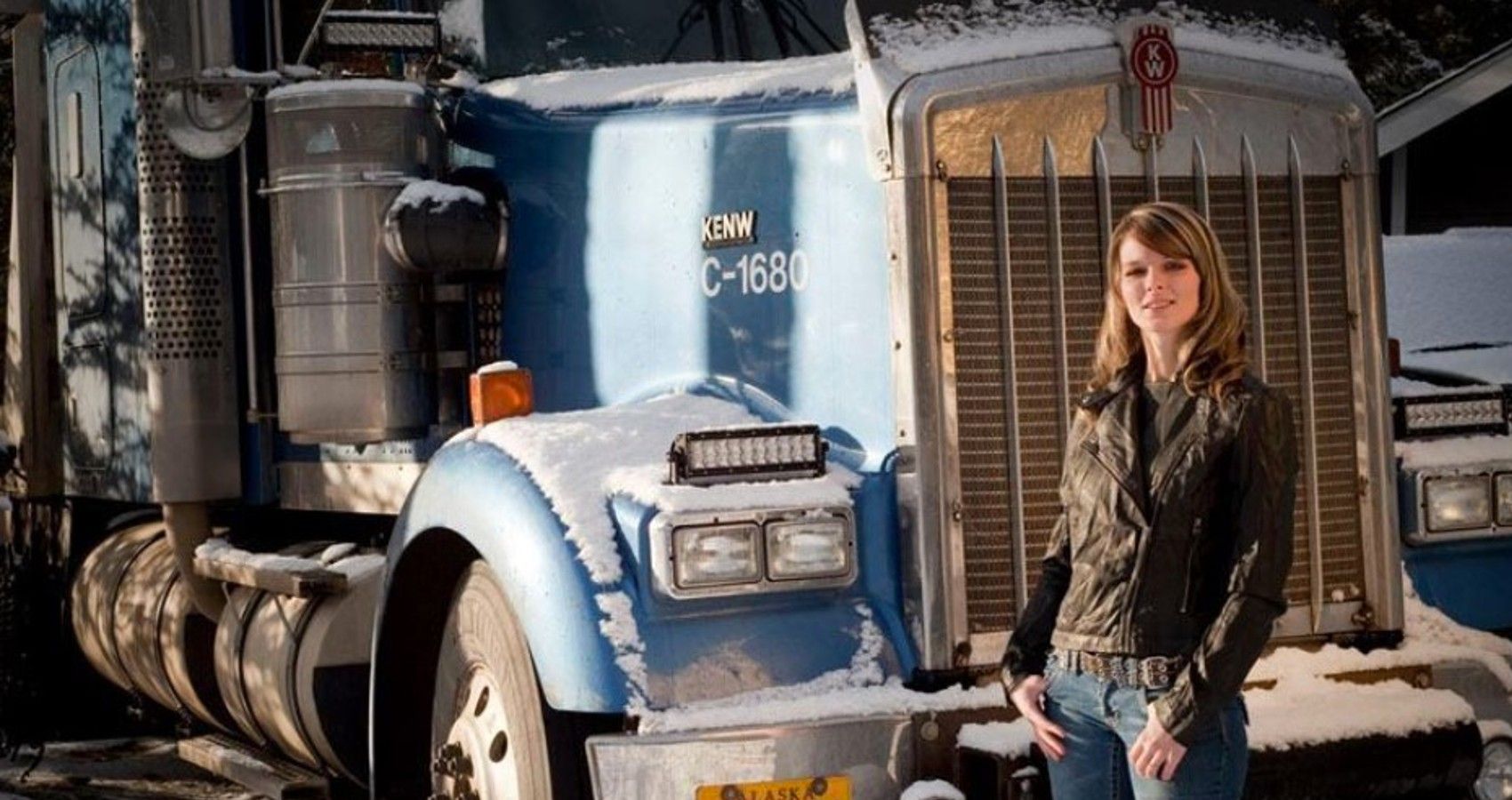 Lisa Kelly posing with her truck