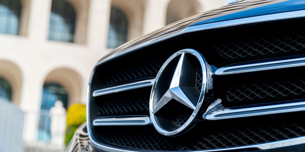 Mercedes-Benz logo on black car grille