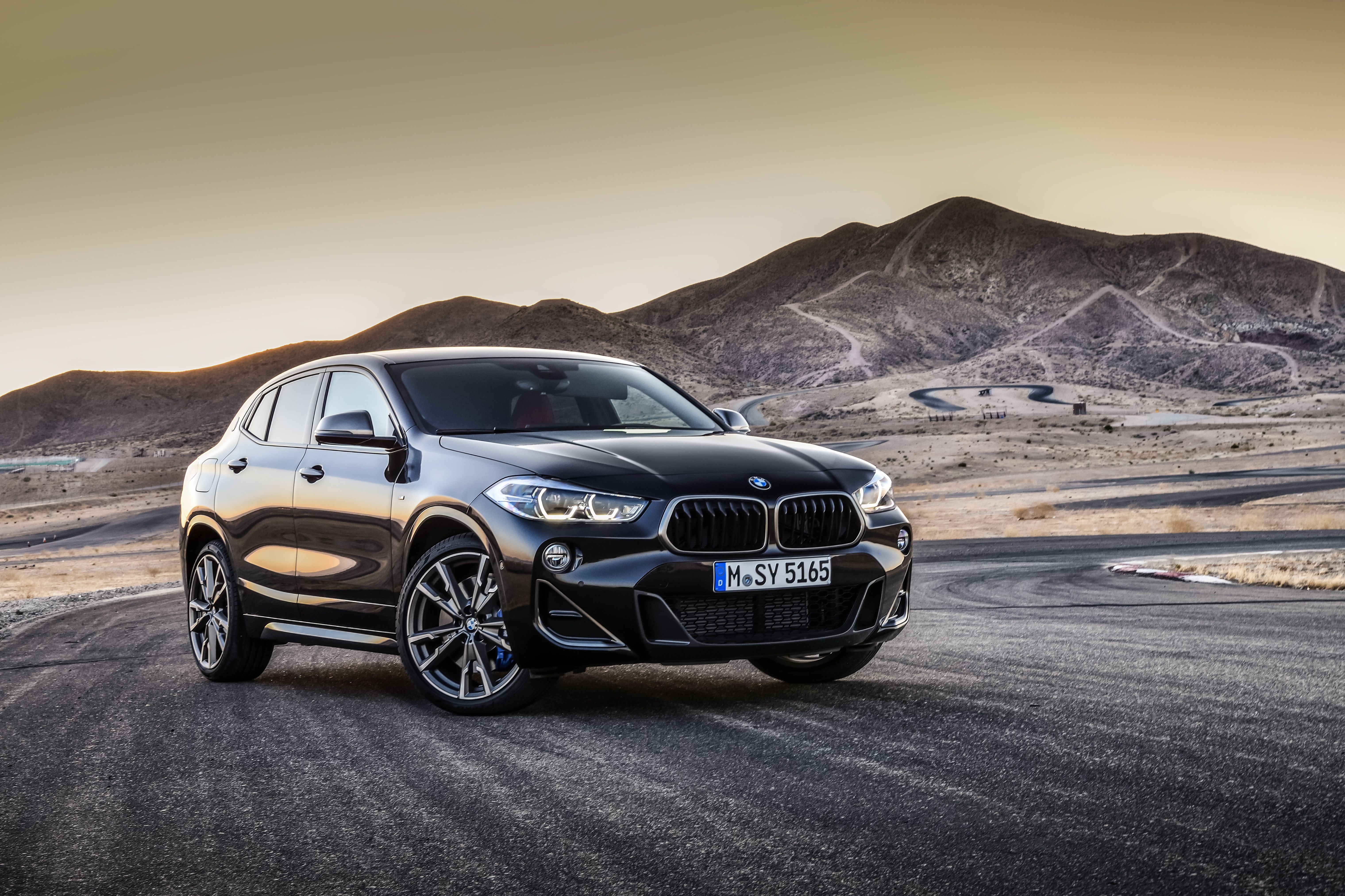 The 2022 BMW X2 parked on the road in nature.