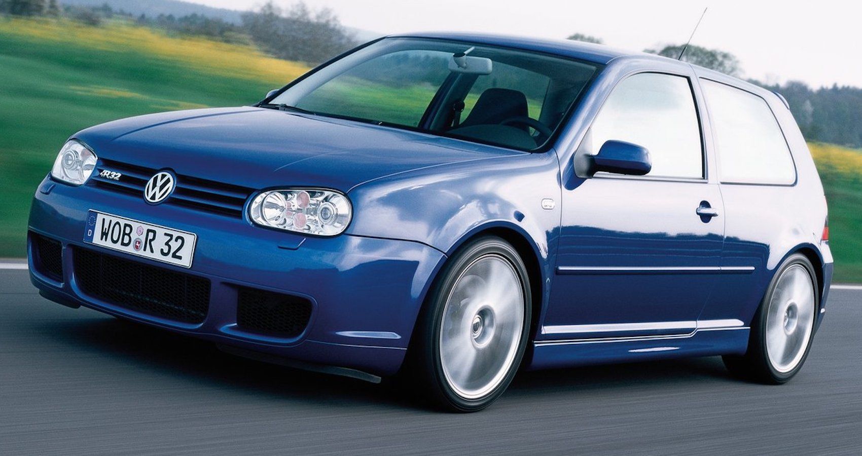 Volkswagen Golf R32 2004 blue car with silver wheels side shot moving in countryside