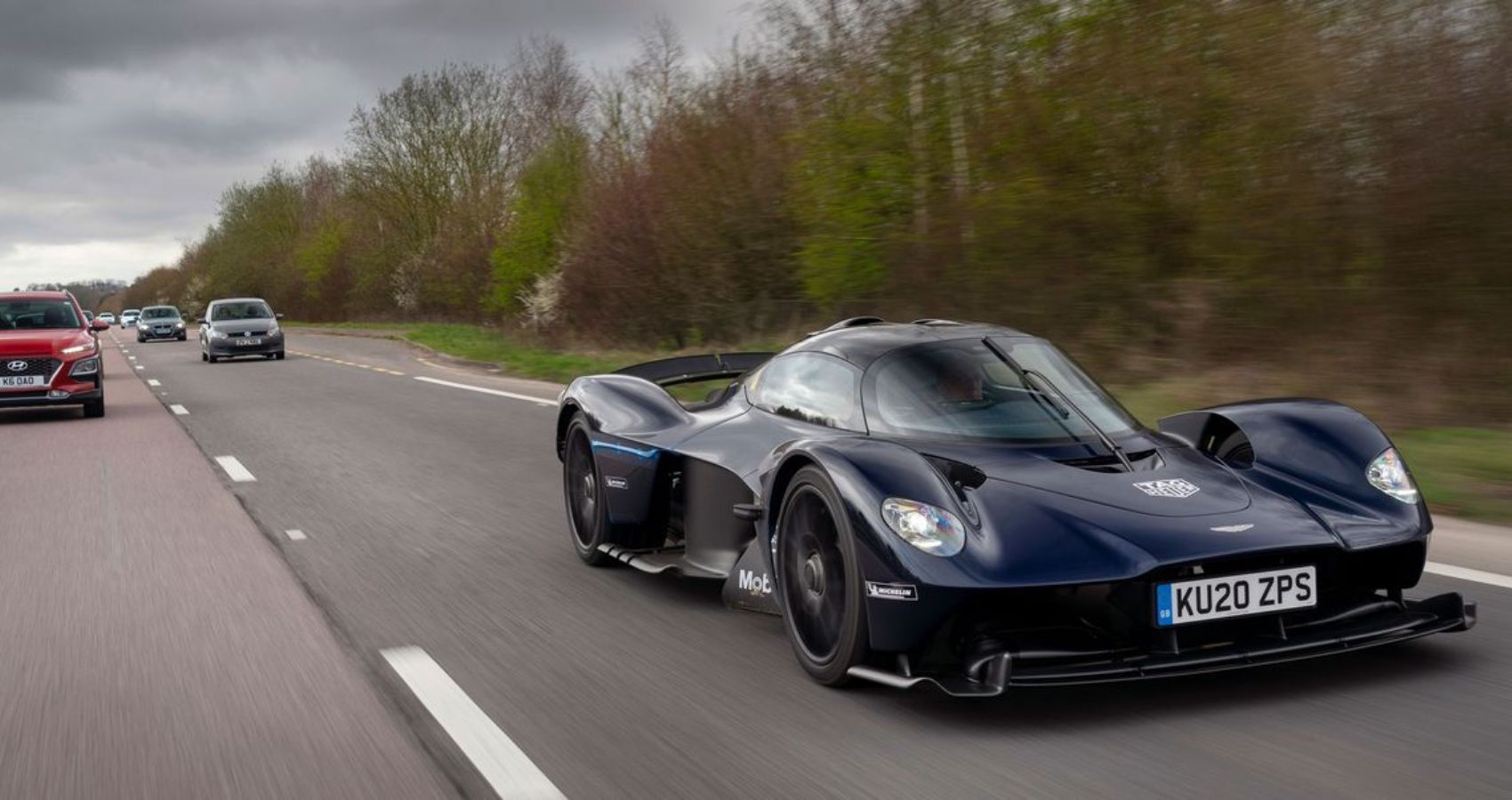 2022 Aston Martin Valkyrie on the road in the middle of traffic