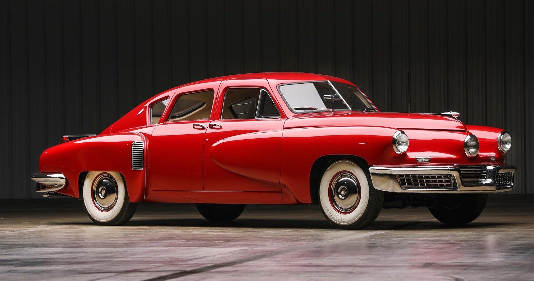 PRESTON TUCKER STANDING NEXT TO A TUCKER 48 AUTO OUTSIDE THE TUCKER  FACTORY. THE TUCKER 48 WAS A REVOLUTIONARY AUTO DECADES AHEAD OF IT'S TIME.  IT WAS CONSIDERED THE SAFEST AUTO IN