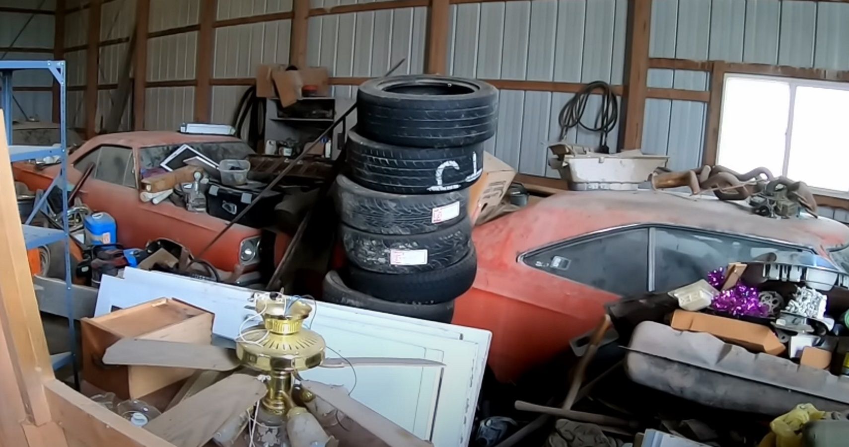 1969 (left) and 1968 Plymouth Road Runner in a debris-laden barn