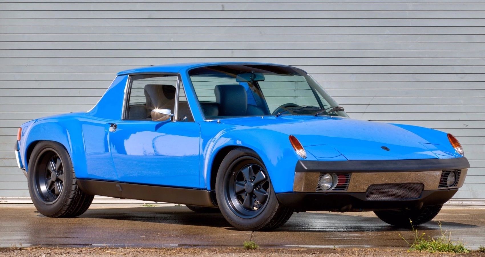 Blue Porsche 914-6 sports car parked